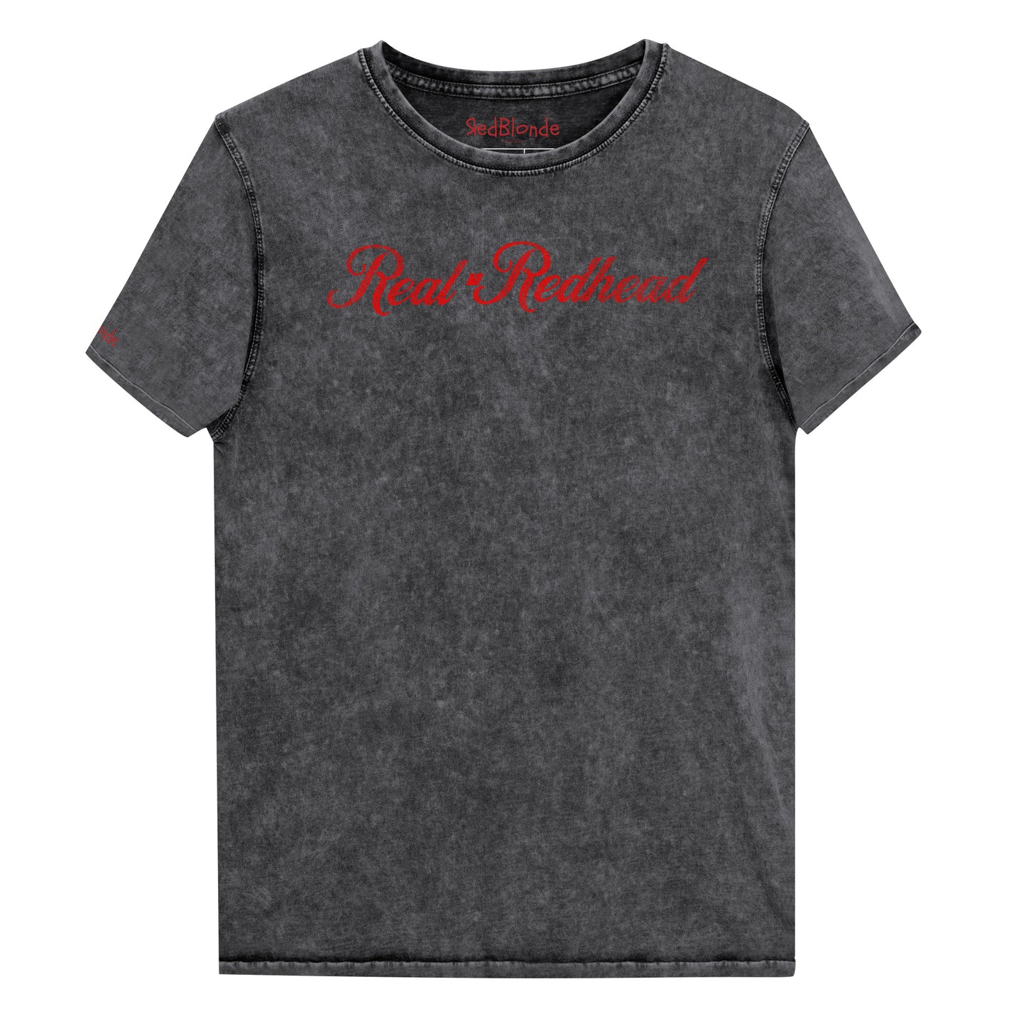 Flatlay of unisex relaxed fit black vintage denim wash slogan t-shirt with 'Real Redhead' in milkshake script red font. Branded RedBlonde in red on inside neck and right sleeve