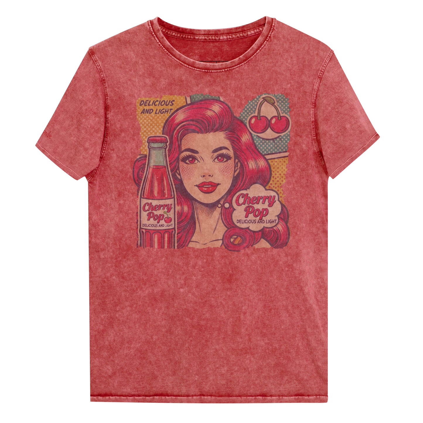 flatlay of unisex vintage garnet red denim wash t-shirt with a pop-art graphic of a redheaded woman with a bottle of cherry pop, cherry graphic and the words 'Cherry Pop, delicious and light' in talk bubble. Branded RedBlonde on inside neck and right sleeve in red