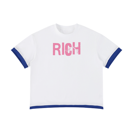 White boxy short sleeve t-shirt with blue layered trim and pink RICH graphic in ED GEIN FONT on the chest.