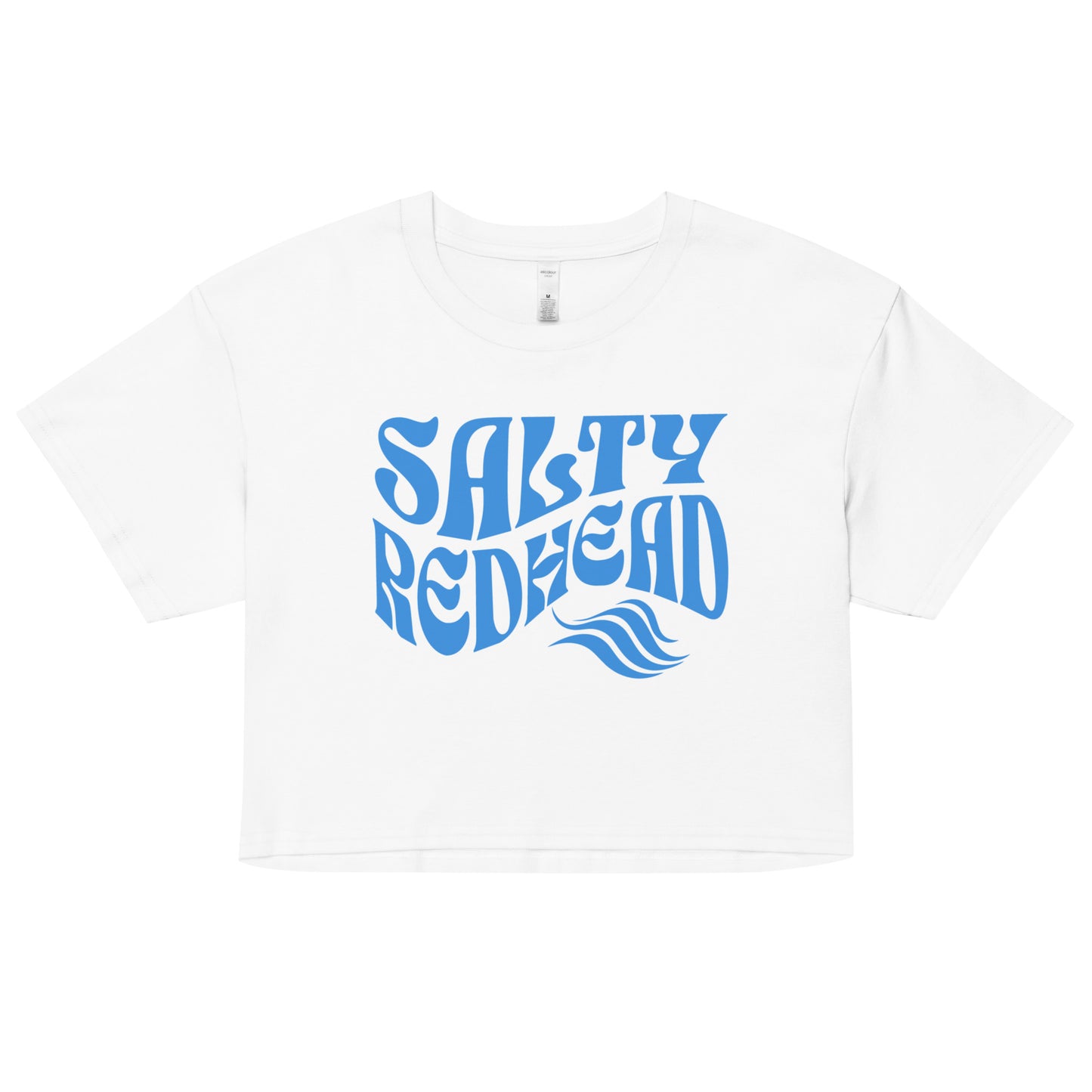 Flatlay of a white loose woman's crop top t-shirt with the words ‘Salty Redhead’ in retro 70s text in blue. branded redblonde on inside neck and right shoulder