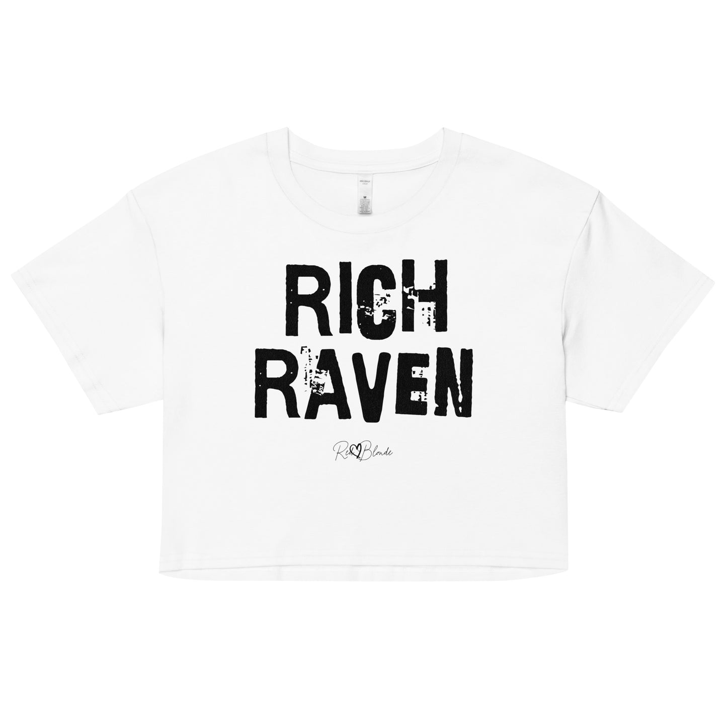 white crop top with a relaxed fit, short sleeves, and a wide crew neckline. The front features bold black distressed lettering reading “RICH RAVEN” with the RedBlonde signature logo underneath in black