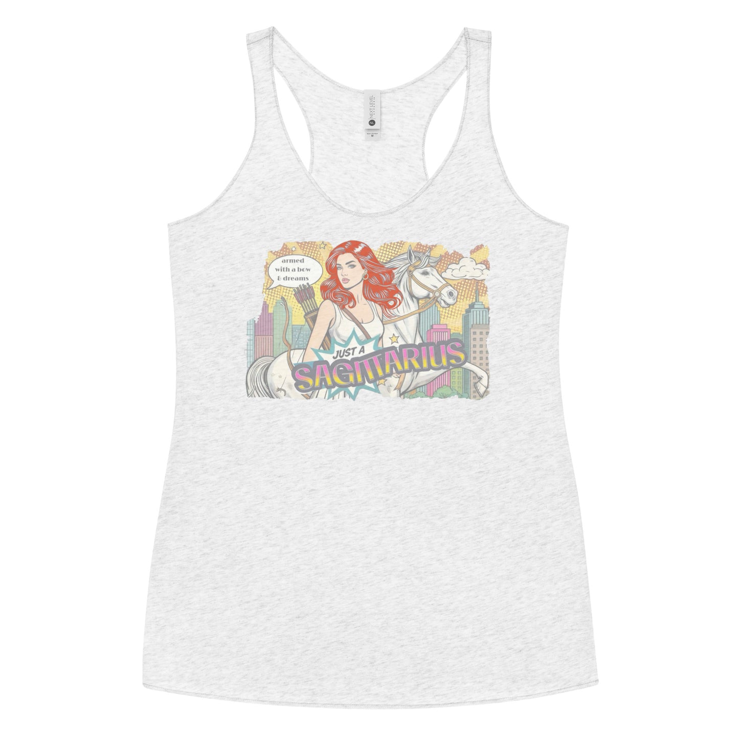 Flatlay of a heather white soft racerback tank t-shirt with a retro pop-art redhead Sagittarius graphic featuring a redhead woman, with bow & arrows, white stallion, and a city backdrop, captioned ‘Just a Sagittarius, armed with a bow & dreams'