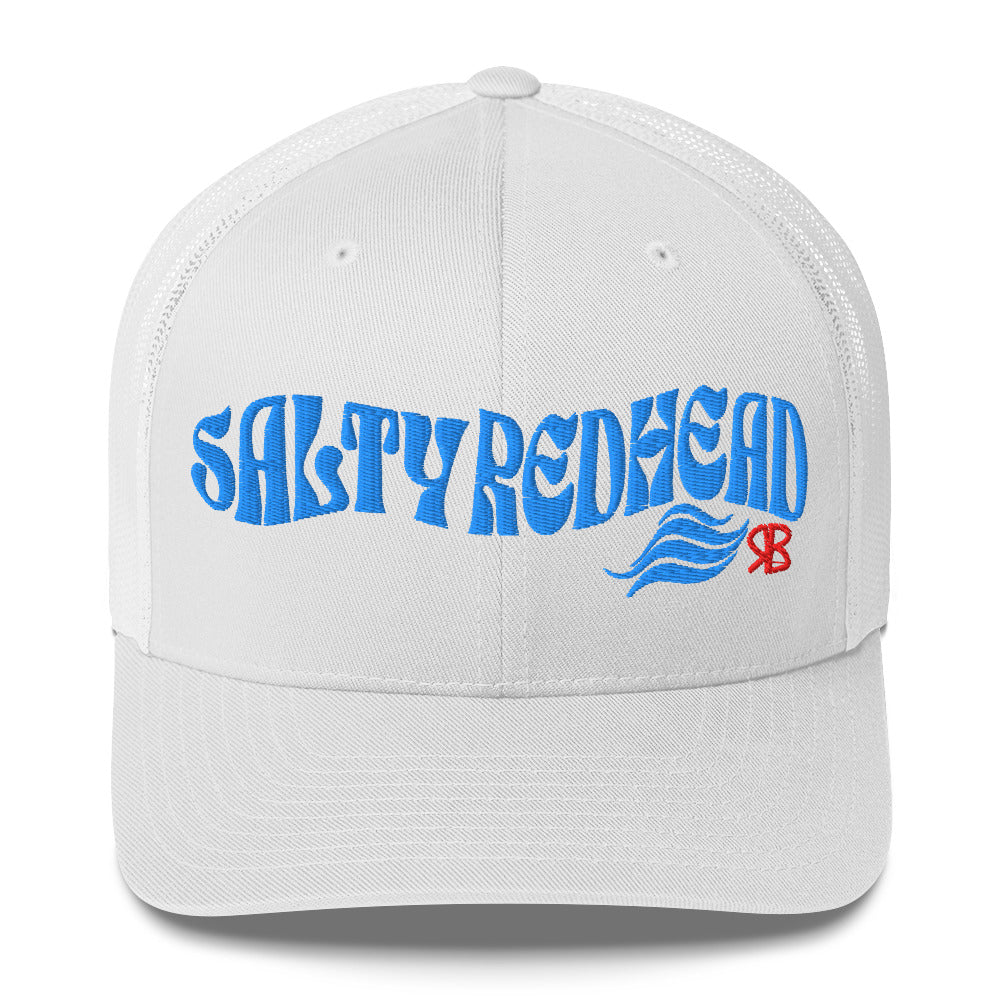 white trucker cap with 'Salty Redhead' in blue Solino display font. Branded RB in red
