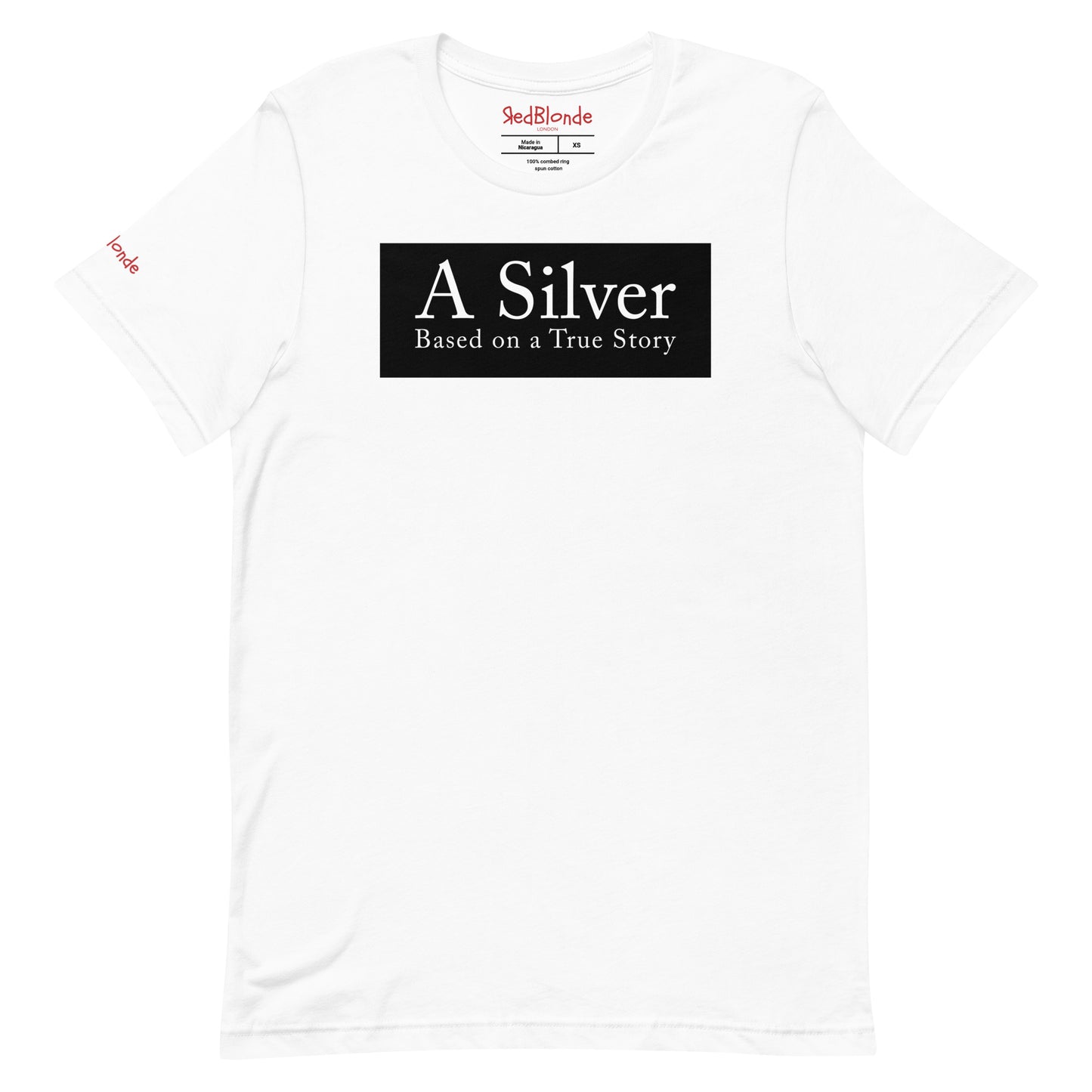 flatlay of a white unisex relaxed fit t-shirt with the slogan 'A Silver - Based on a True Story' in white text in a black box graphic. Branded RedBlonde London in red on inside neck and right sleeve
