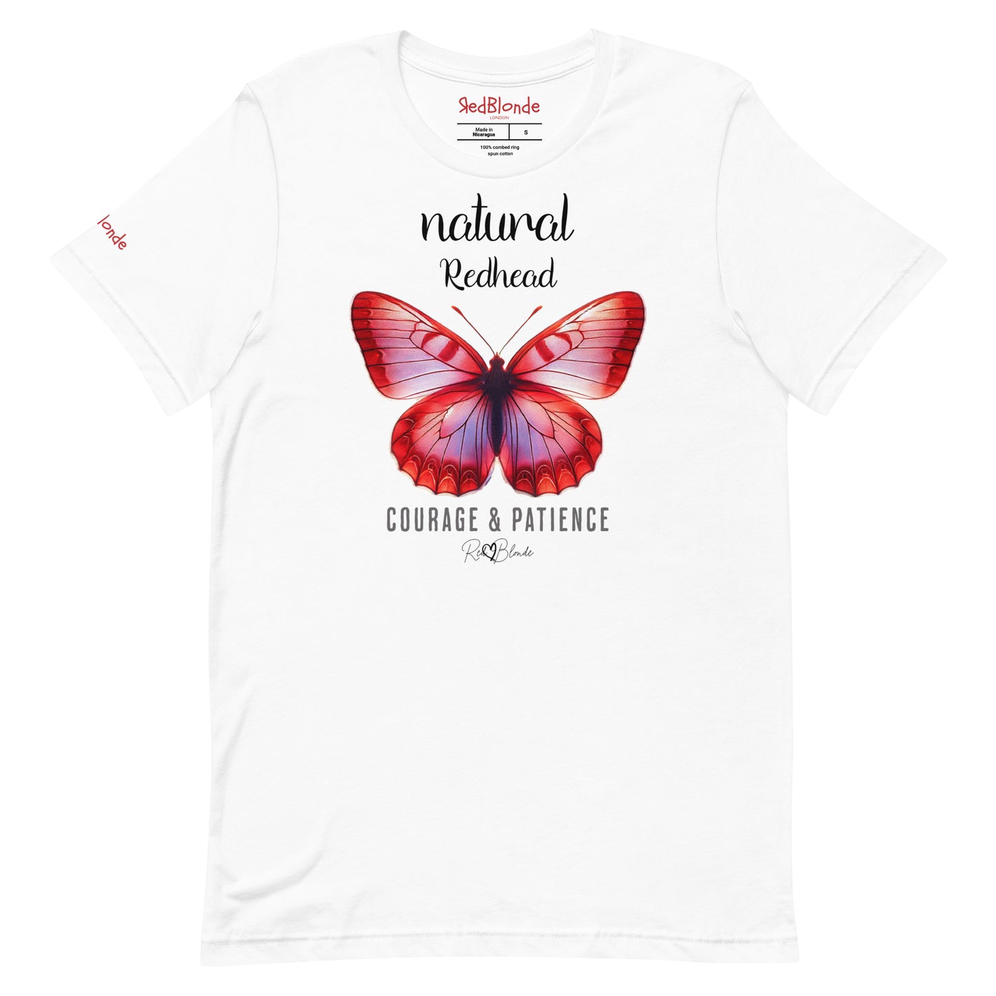 Flatlay of white unisex relaxed fit t-shirt with the words natural redhead in arionna font above a graphic of a red butterfly with 'COURAGE & PATIENCE' below in adventurer 06 font signed off by RedBlonde. Branded RedBlonde London on inside neck and right sleeve