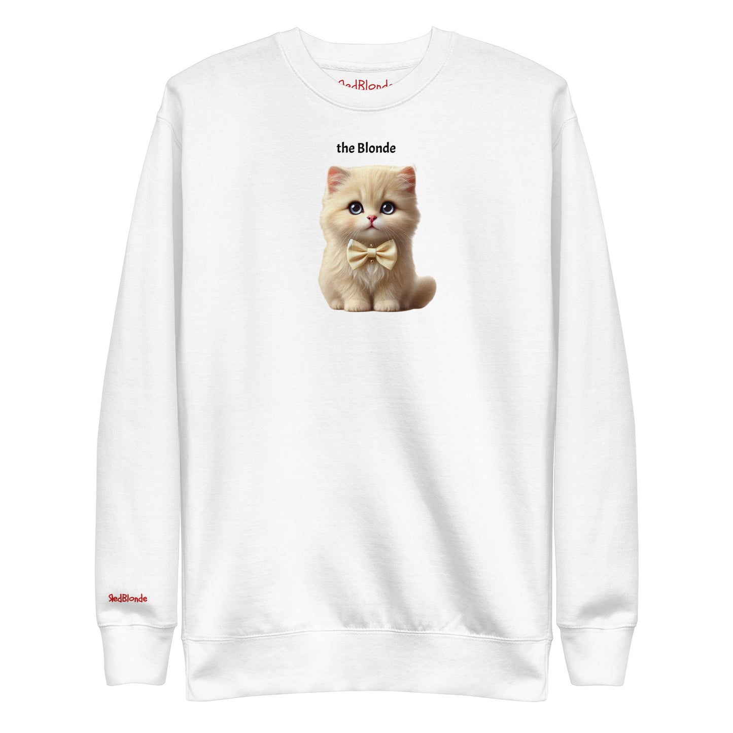 Flatlay of white relaxed fit unisex sweatshirt with a cute graphic of a blonde kitten wearing a bow-tie and the words 'the Blonde' linking to Blonde hair. Branded RedBlonde in red on inside neck and right cuff