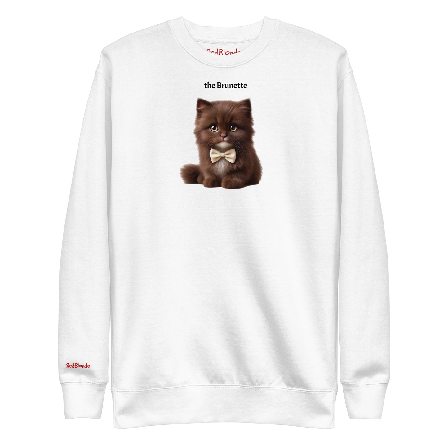 Flatlay of white relaxed fit unisex sweatshirt with a cute graphic of a brunette kitten wearing a bow-tie and the words 'the Brunette' linking to Brunette hair. Branded RedBlonde in red on inside neck and right cuff