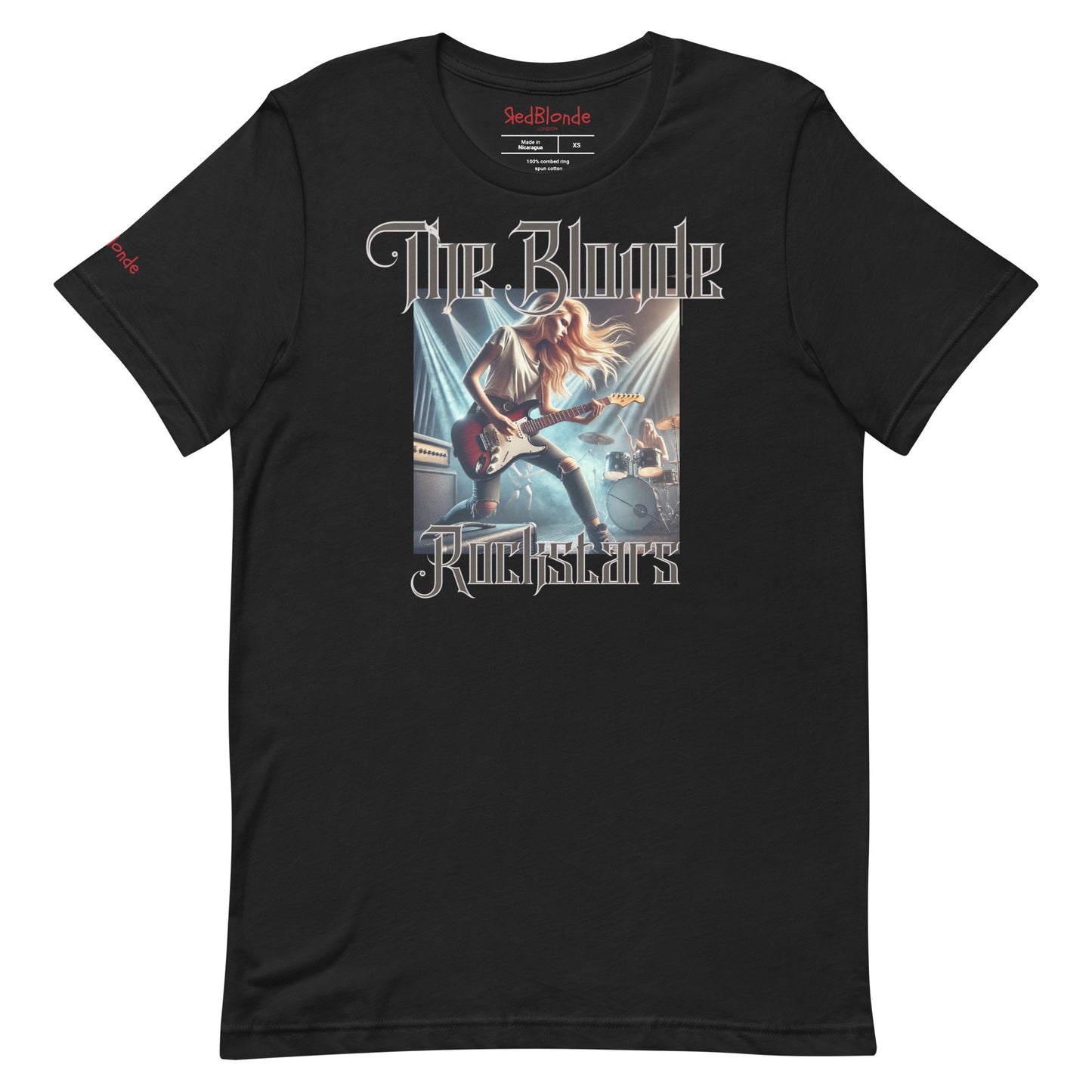 A black unisex t-shirt with a graphic of a blonde female rock guitarist on stage with a drummer in the background, illuminated by stage lights. The text ‘The Blonde Rockstars’ is in bold, metallic avalen rekas font above and below the image. Branded RedBlonde London in red on the inside neck and right sleeve.