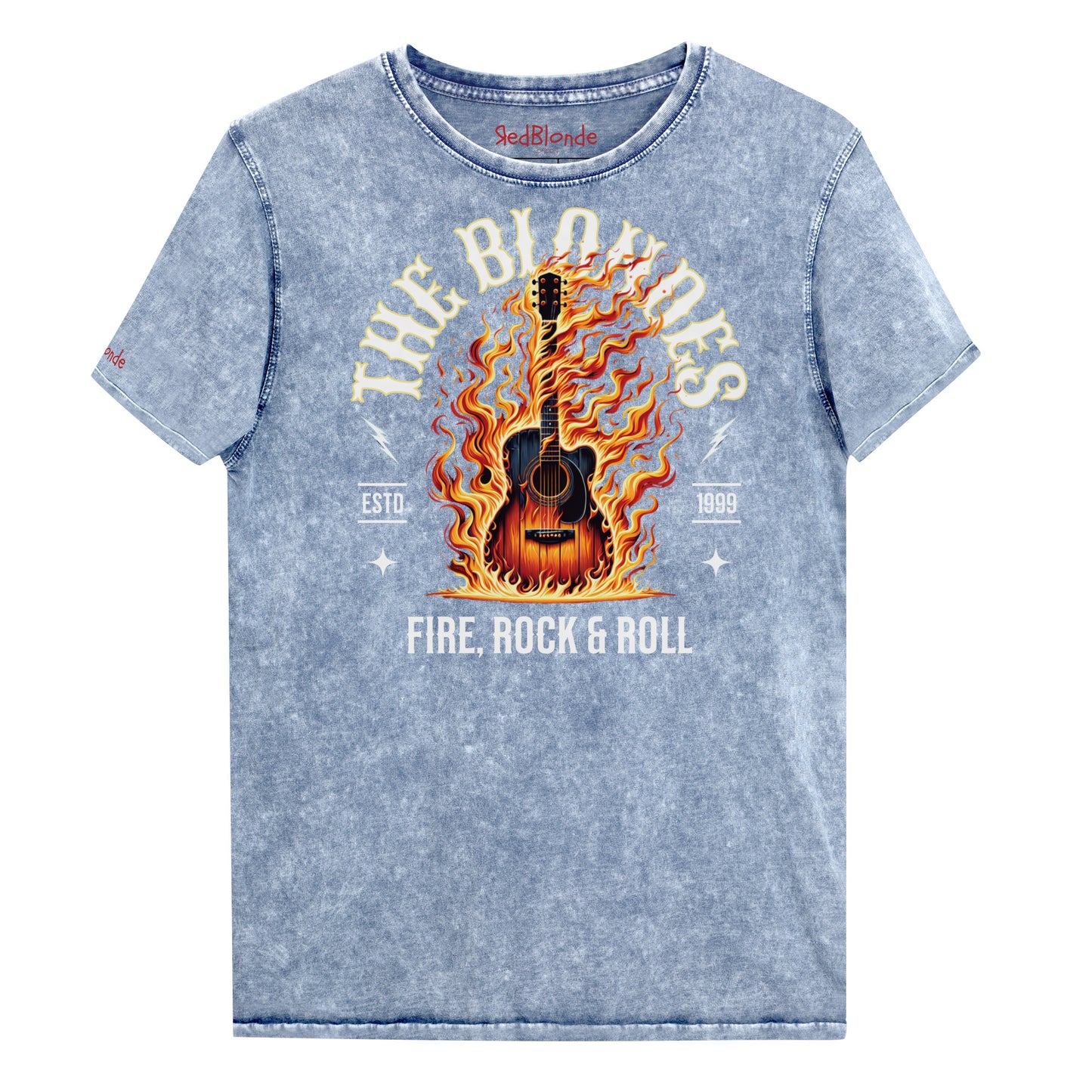 A blue denim wash unisex t-shirt with a  graphic of a wooden guitar on fire with ‘THE BLONDES’ in Sancreek font above the burning guitar and ‘FIRE, ROCK & ROLL' underneath. Branded RedBlonde London in inside neck and right sleeve.
