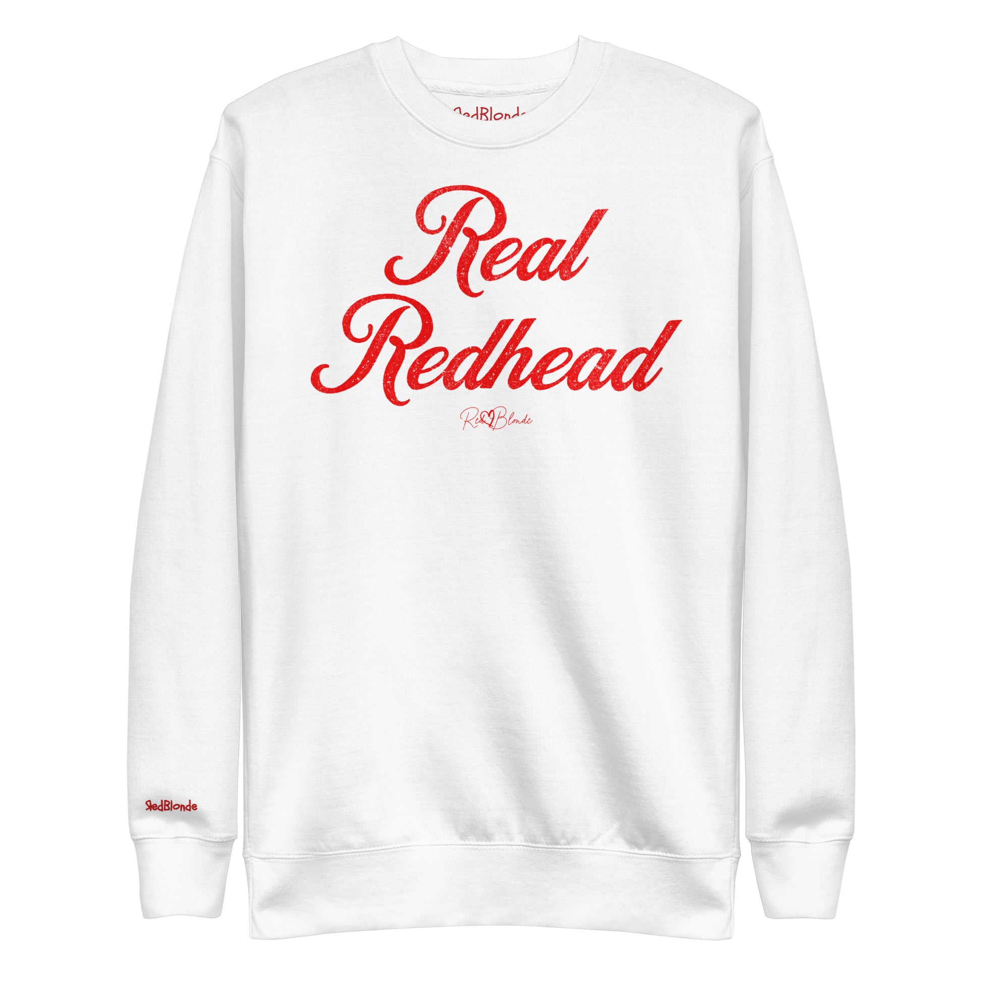 A classic white relaxed fit unisex sweatshirt with the words 'Real Redhead' written in red vintage milkstore font, like coco cola script. Branded RedBlonde London in red on inside neck and right sleeve 