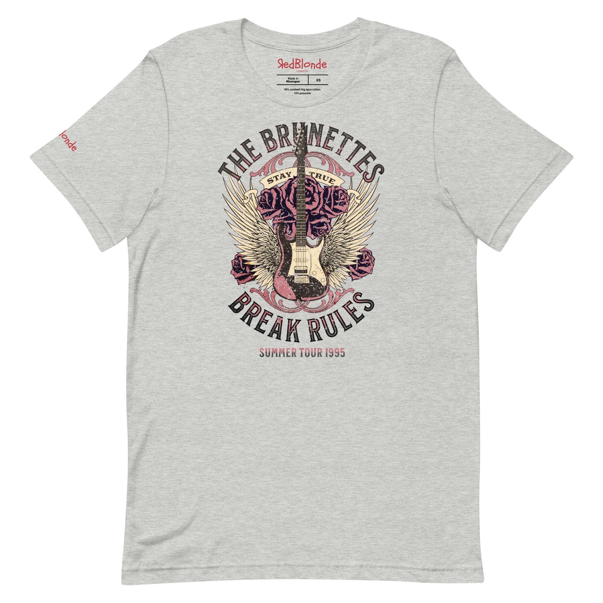 A grey unisex t-shirt with a burnt pink & beige graphic of a guitar with bird wings emerging from the side. The graphic features ‘THE BRUNETTES’ in Brookfield font above the guitar, ‘STAY TRUE' across the top and 'BREAK THE RULES’ underneath. Branded RedBlonde London in inside neck and right sleeve.