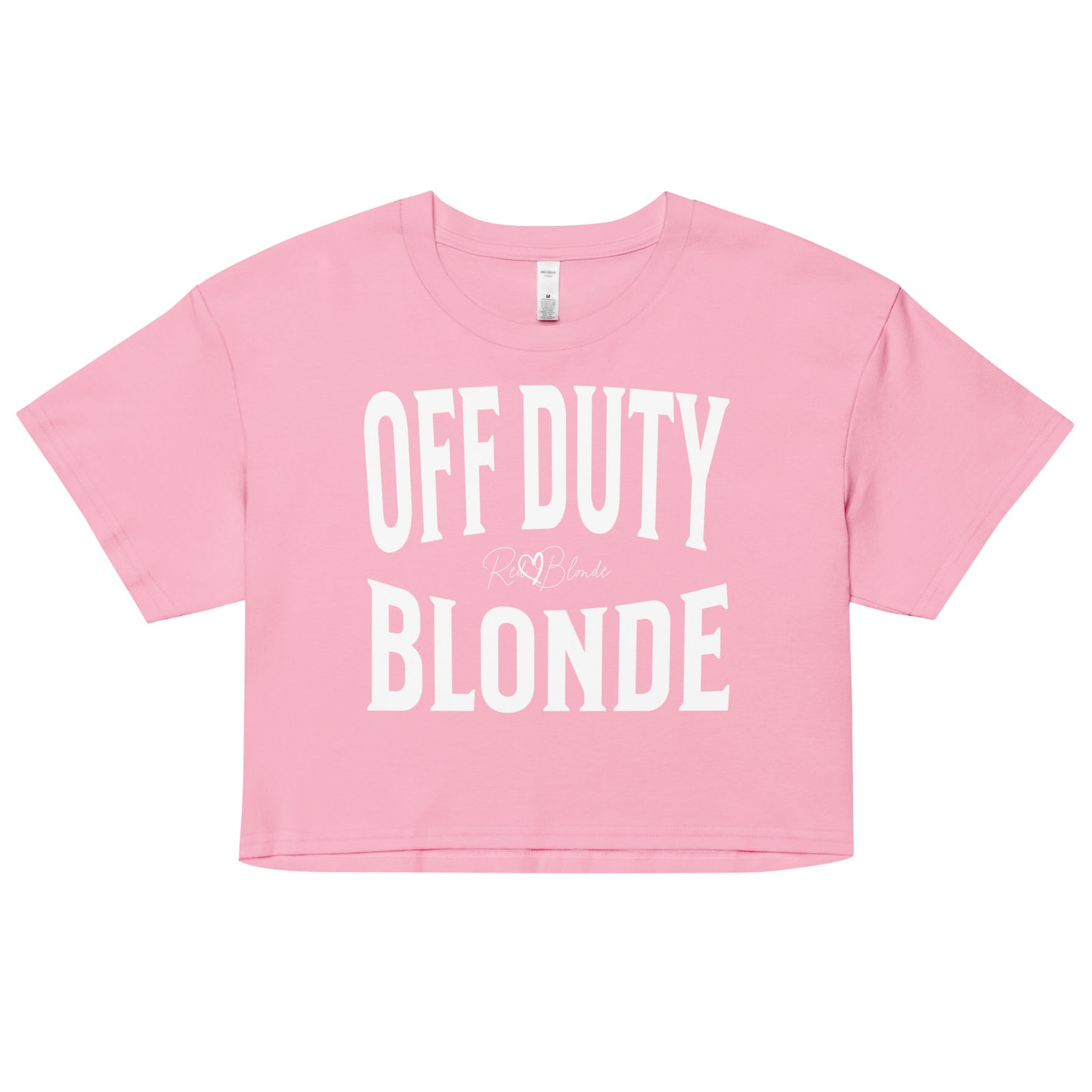 A pink women's crop top with the words 'OFF DUTY BLONDE' written in large Brookfield white font, across the chest. signed RedBlonde in handwritten script inbetween off duty and blonde.