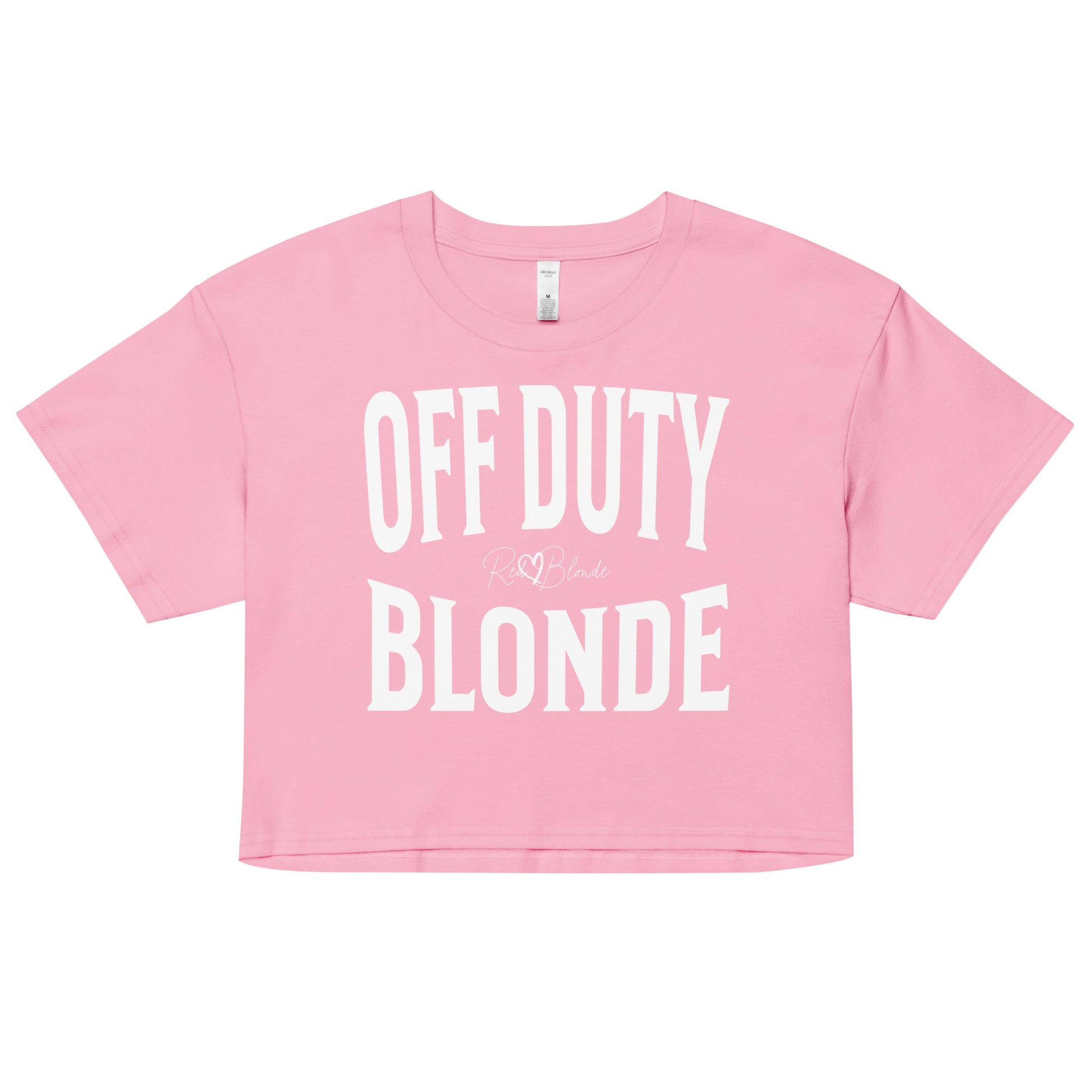 A pink women's crop top with the words 'OFF DUTY BLONDE' written in large Brookfield white font, across the chest. signed RedBlonde in handwritten script inbetween off duty and blonde.