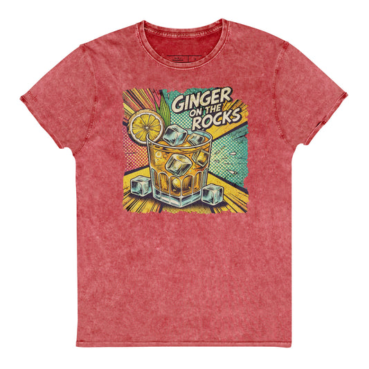 A red acid-wash unisex denim look T-shirt featuring a vibrant, retro-style graphic of a cocktail glass filled with ice cubes, a lemon slice, and the text "GINGER ON THE ROCKS" in bold comic-style lettering. The background of the graphic includes colorful pop art elements in yellow, green, and turquoise tones. Branded RedBlonde on the inside neck and right sleeve