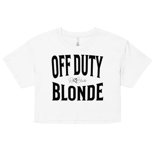 A white women's crop top with the words 'OFF DUTY BLONDE' written in large Brookfield black font, across the chest. signed RedBlonde in handwritten script inbetween off duty and blonde.