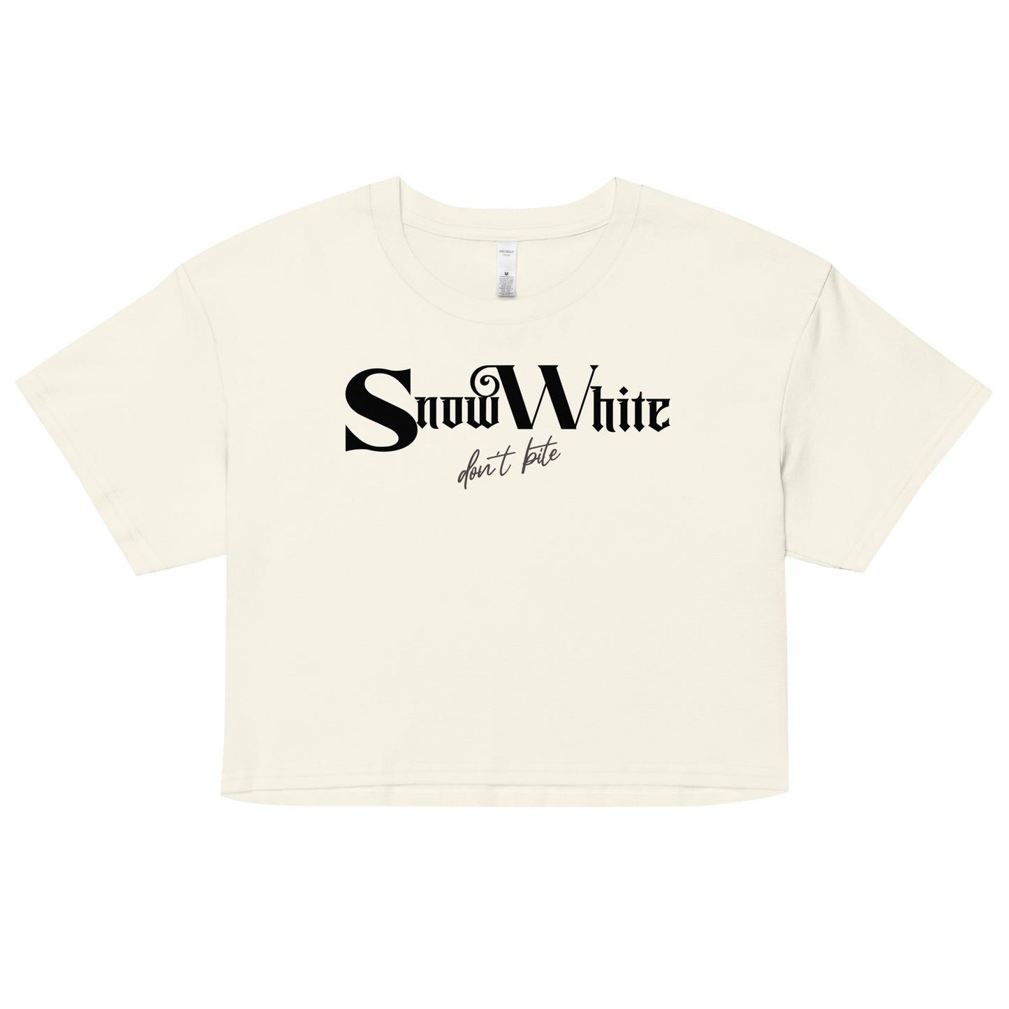 Beige women’s crop top featuring black Angel Rhapsody gothic-inspired font that reads “Snow White” and the phrase “don’t bite” written underneath in a cursive script.