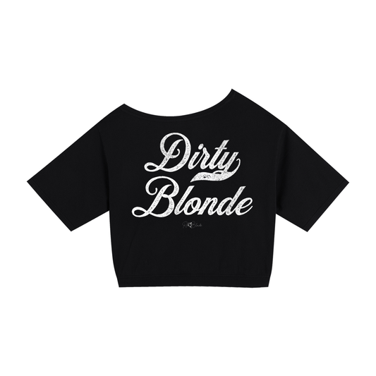 Back view of a black asymmetric off-the-shoulder waist length t-shirt featuring the bold white distressed Milkstore font “Dirty Blonde” with the RedBlonde logo printed below. The relaxed, oversized fit and one-shoulder neckline give it a modern, effortless look.