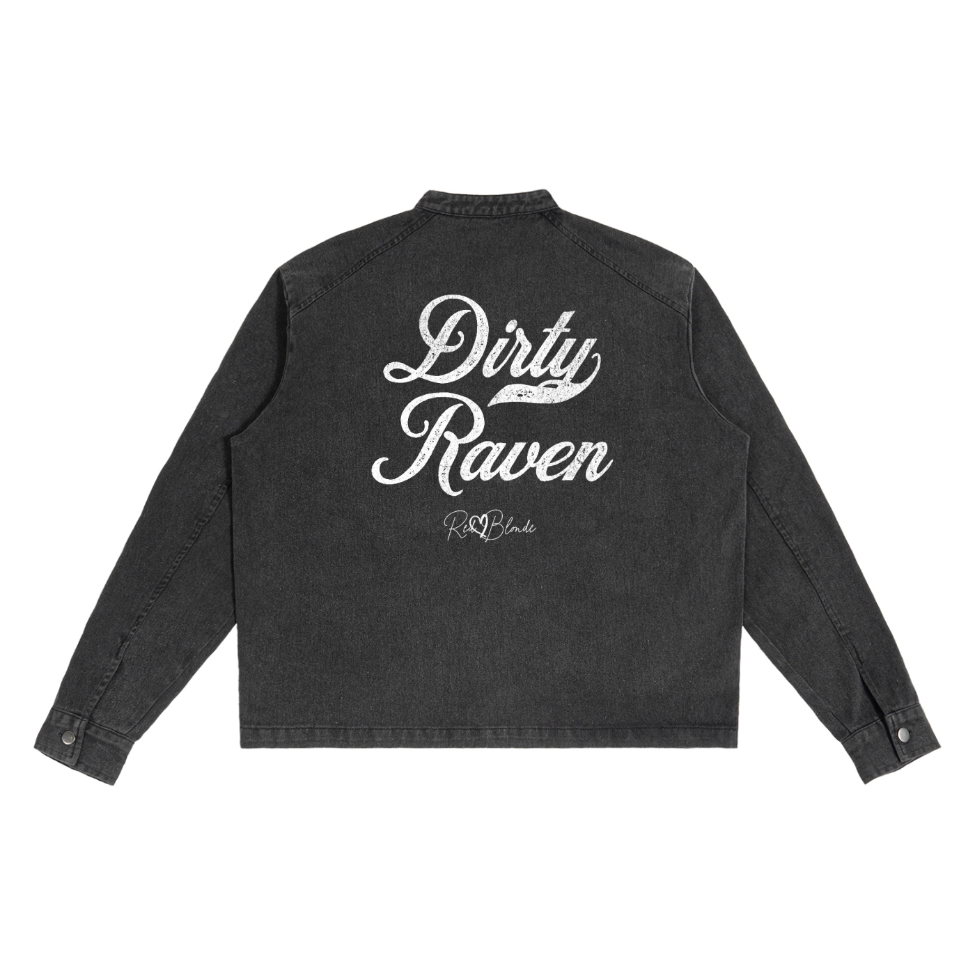 The back of a washed-black denim jacket showing large white embroidered Miklstore font script reading "Dirty Raven" with the RedBlonde signature below. The jacket has a relaxed, slightly cropped silhouette and long sleeves with button cuffs.