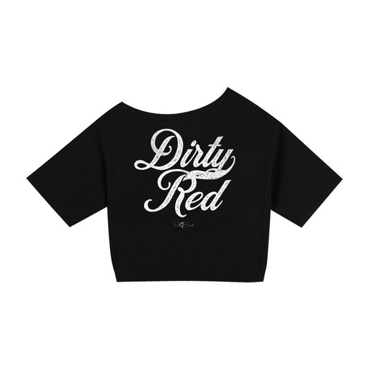 Back view of a black asymmetric off-the-shoulder waist length t-shirt featuring the bold white distressed Milkstore font “Dirty Red” with the RedBlonde logo printed below. The relaxed, oversized fit and one-shoulder neckline give it a modern, effortless look.