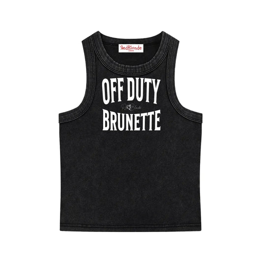 A black sleeveless vintage acid wash tank top laid flat on a white background, with white text on the chest reading “OFF DUTY BRUNETTE” in bold Brookfield lettering, and a small cursive RedBlonde signature logo between the words. 
