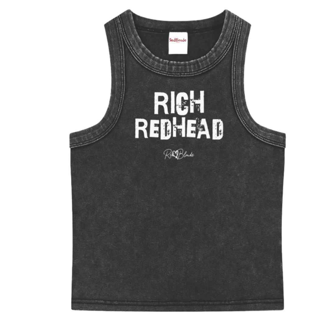 Black acid-wash vintage tank top with bold white Ed Gein font “RICH REDHEAD" slogan on the front and RedBlonde logo beneath.