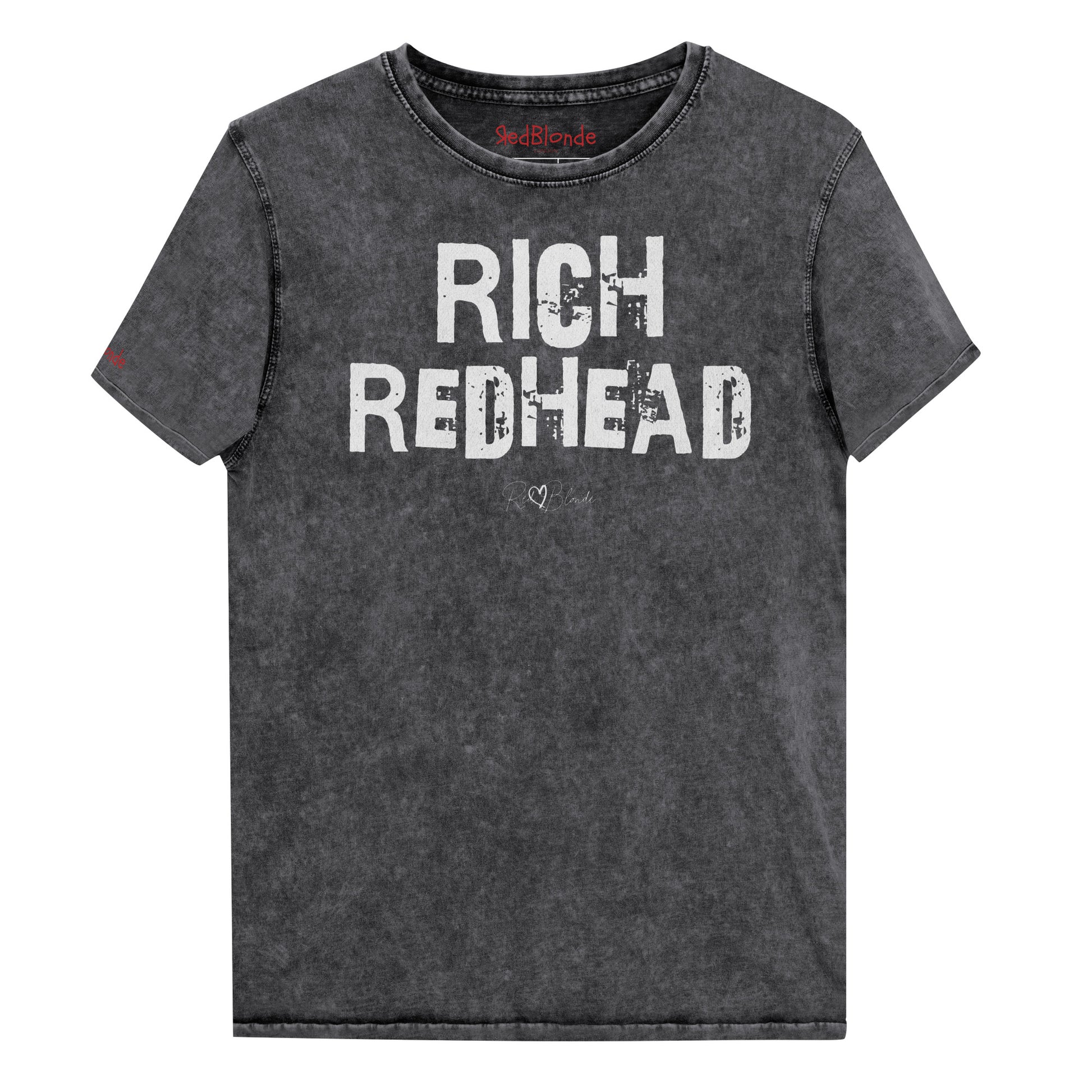 a black acid-wash unisex denim T-shirt with a distressed vintage look. The shirt features the bold white text “RICH REDHEAD” in a weathered Ed Gein font, and features the RedBlonde signature logo. The shirt has short sleeves, a crew neckline, and visible seam detailing for a rugged, casual style. Branded Redblonde on inside neck and right sleeve