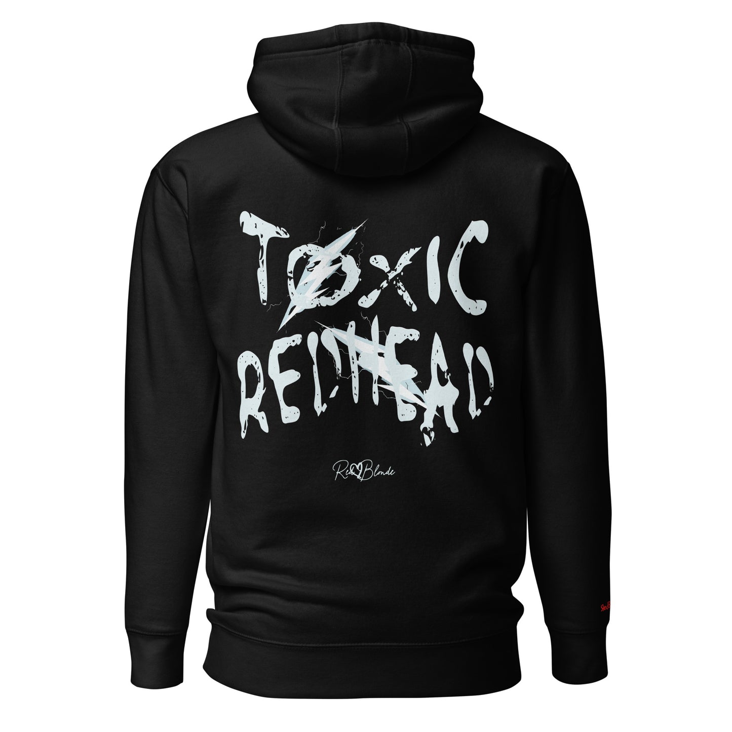 Back view of a black unisex hoodie featuring bold distressed white Chainsaw Carnage text reading “Toxic Redhead” with lightning-style accents and the RedBlonde signature logo underneath. The design has an edgy, electric aesthetic.It features the text 'Blonde' embroidered on the front. Branded RedBlonde in red on right sleeve.