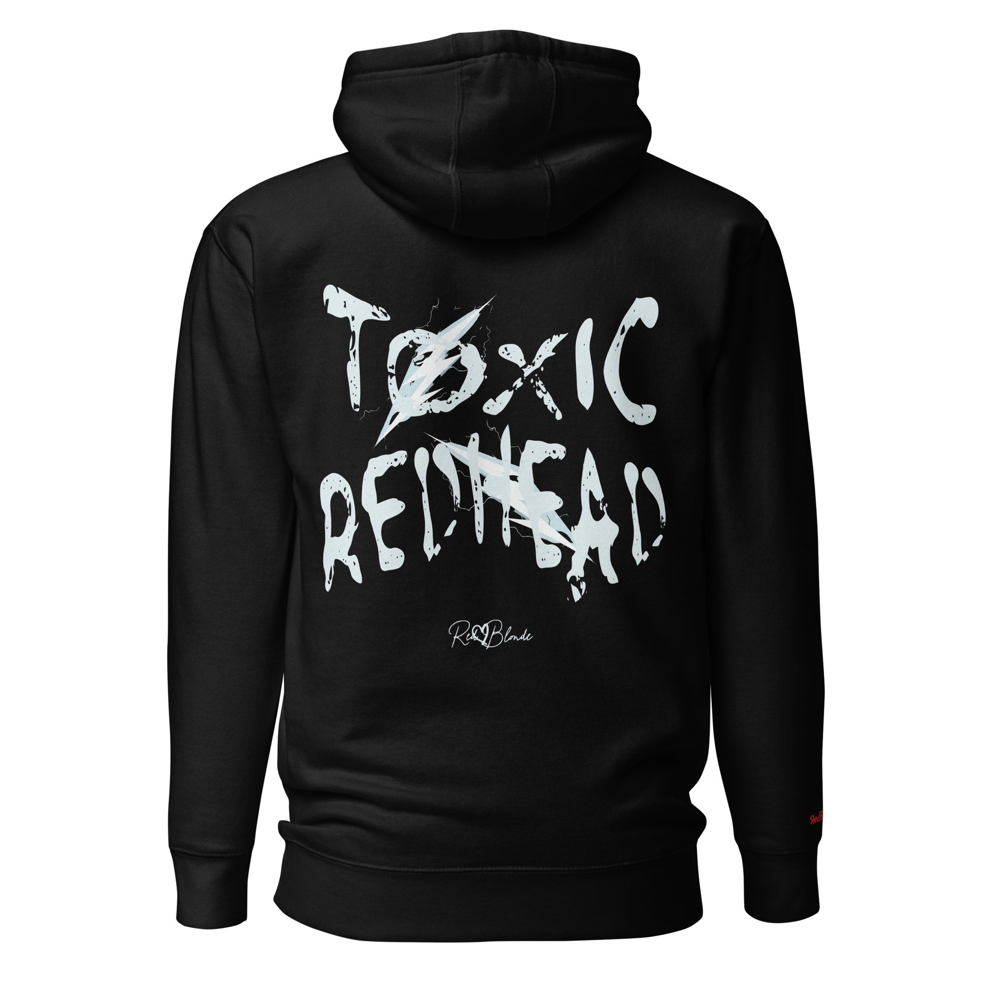 Back view of a black unisex hoodie featuring bold distressed white Chainsaw Carnage text reading “Toxic Redhead” with lightning-style accents and the RedBlonde signature logo underneath. The design has an edgy, electric aesthetic.It features the text 'Blonde' embroidered on the front. Branded RedBlonde in red on right sleeve.