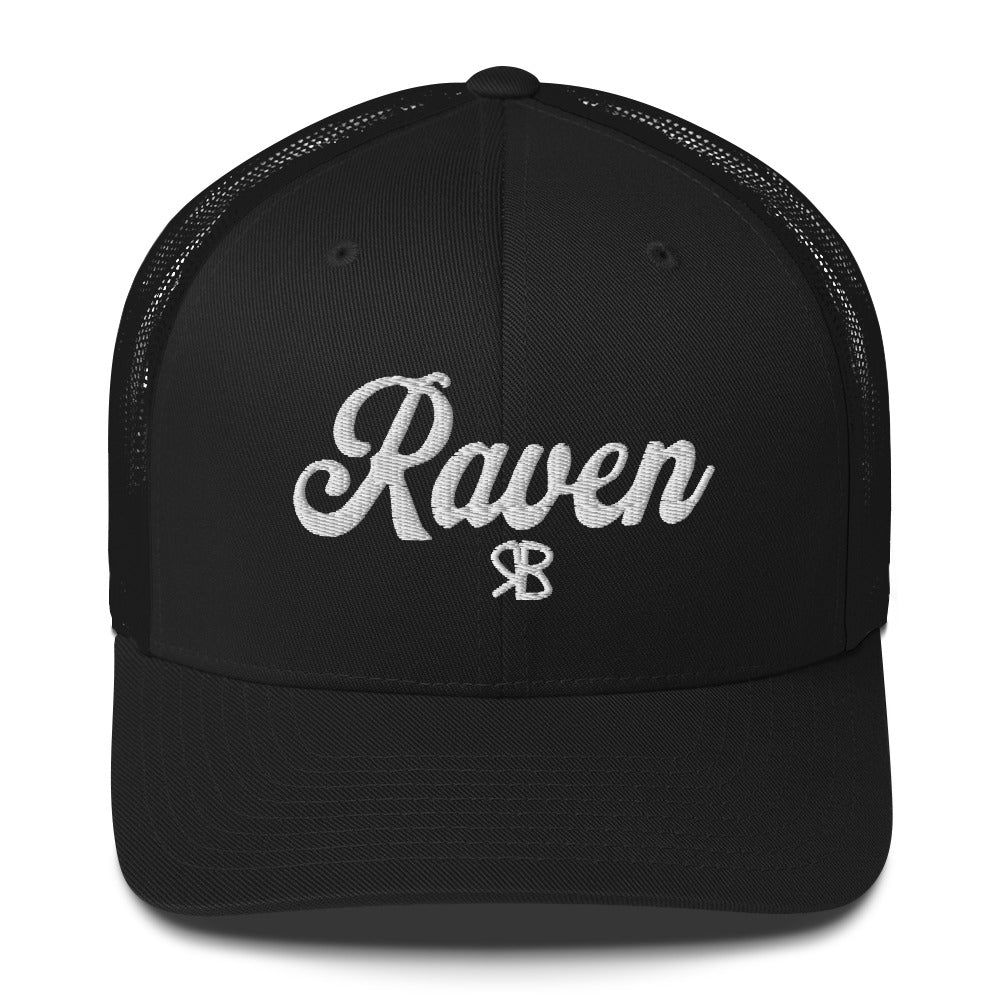 Black trucker cap with 'Raven' in white adventurer 01 font on front. Branded RB