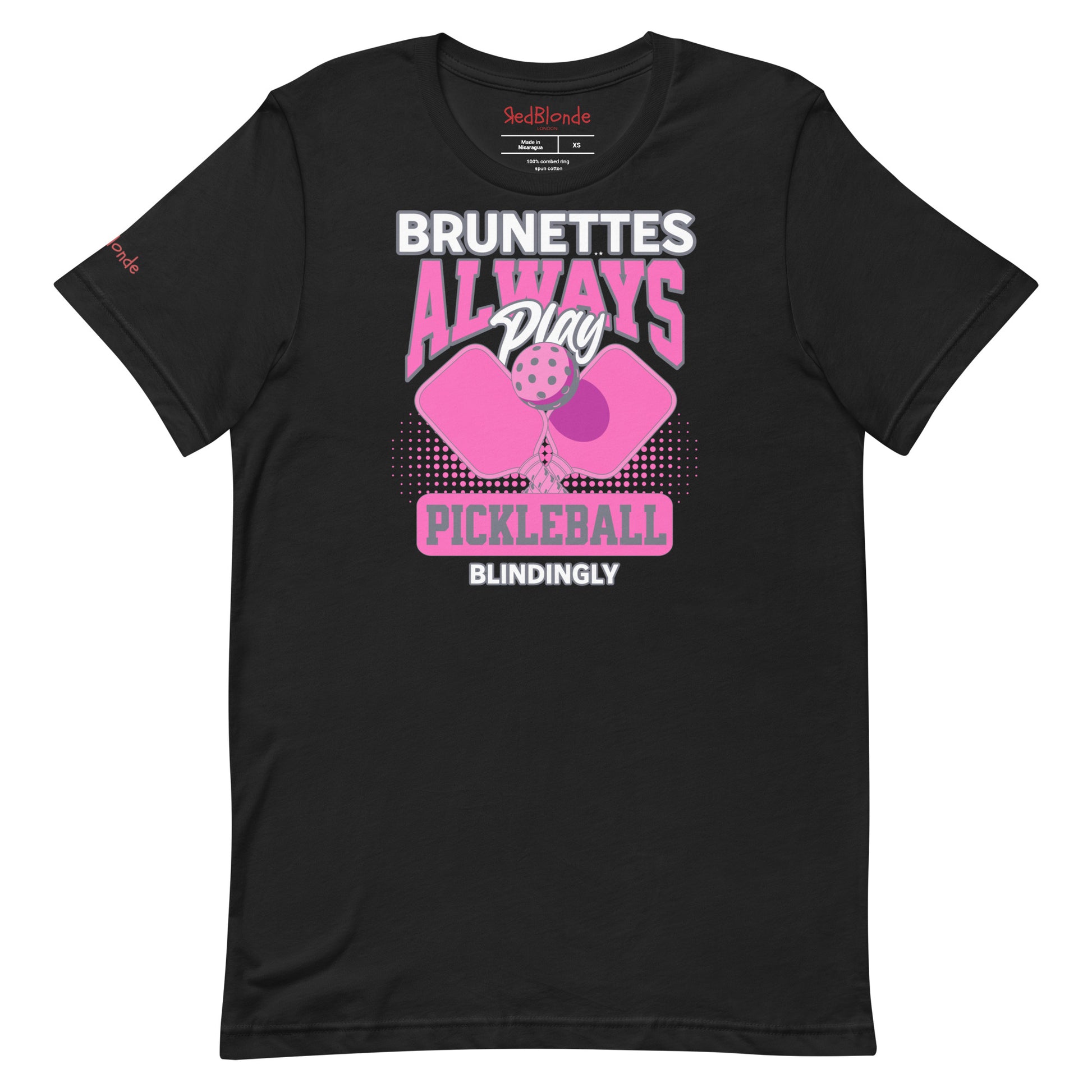 Black unisex t-shirt with bold pink and white graphic that says "Brunettes Always Play Pickleball Blindingly," featuring two pink pickleball paddles and a ball. Branded RedBlonde on inside neck and right sleeve