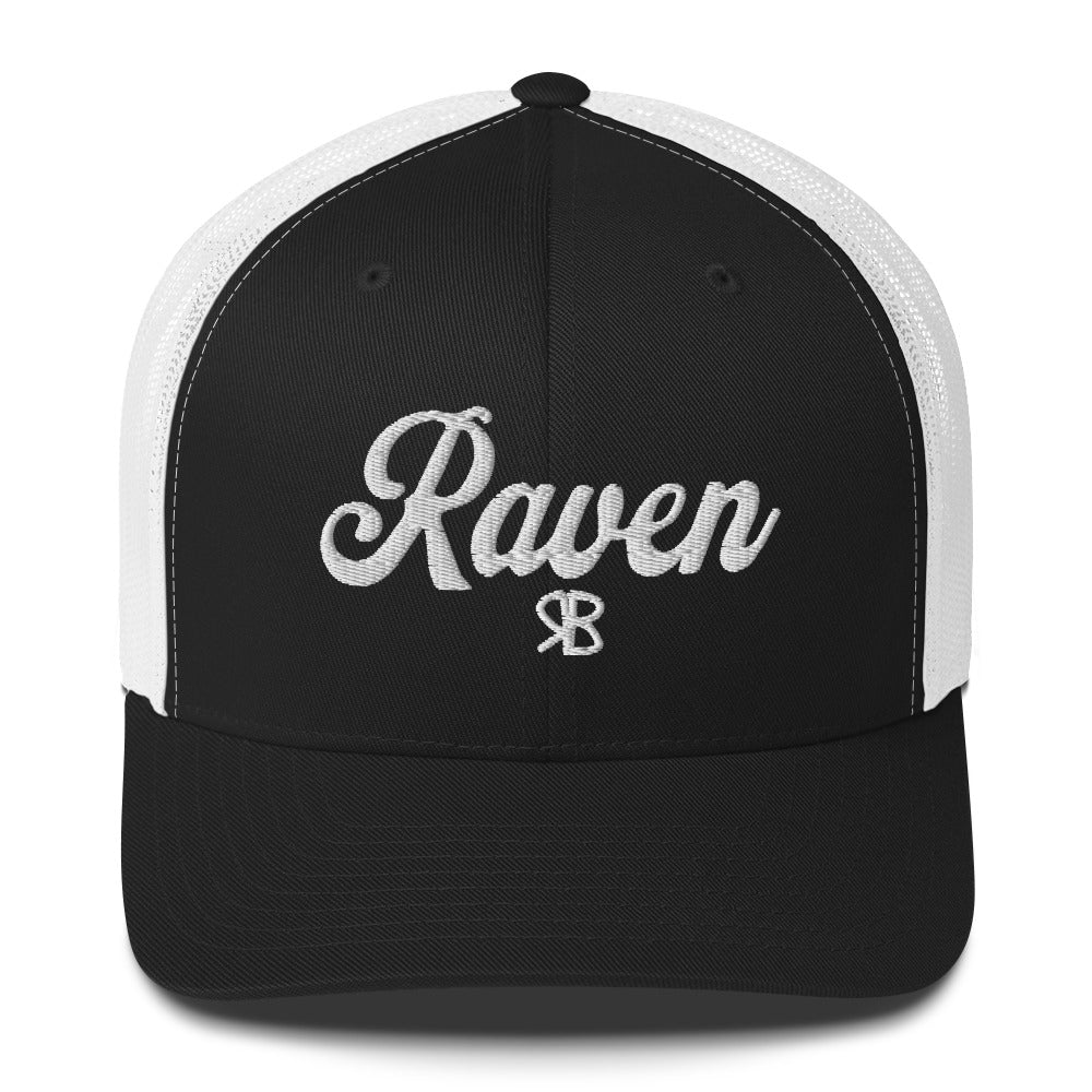 Black/white trucker cap with 'Raven' in white adventurer 01 font on front. Branded RB