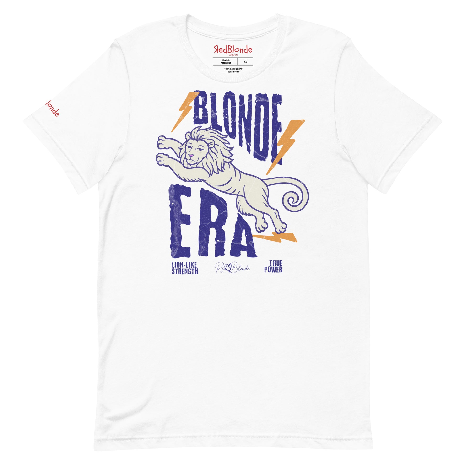 White unisex short-sleeve t-shirt featuring a bold graphic of a leaping lion outlined in purple, surrounded by orange lightning bolts. The text “BLONDE ERA” appears in large distressed purple letters, with smaller text reading “LION-LIKE STRENGTH” and “TRUE POWER” underneath. Signed RedBlonde. The brand name “RedBlonde” is printed in red on the inside collar label and on the right sleeve near the cuff.