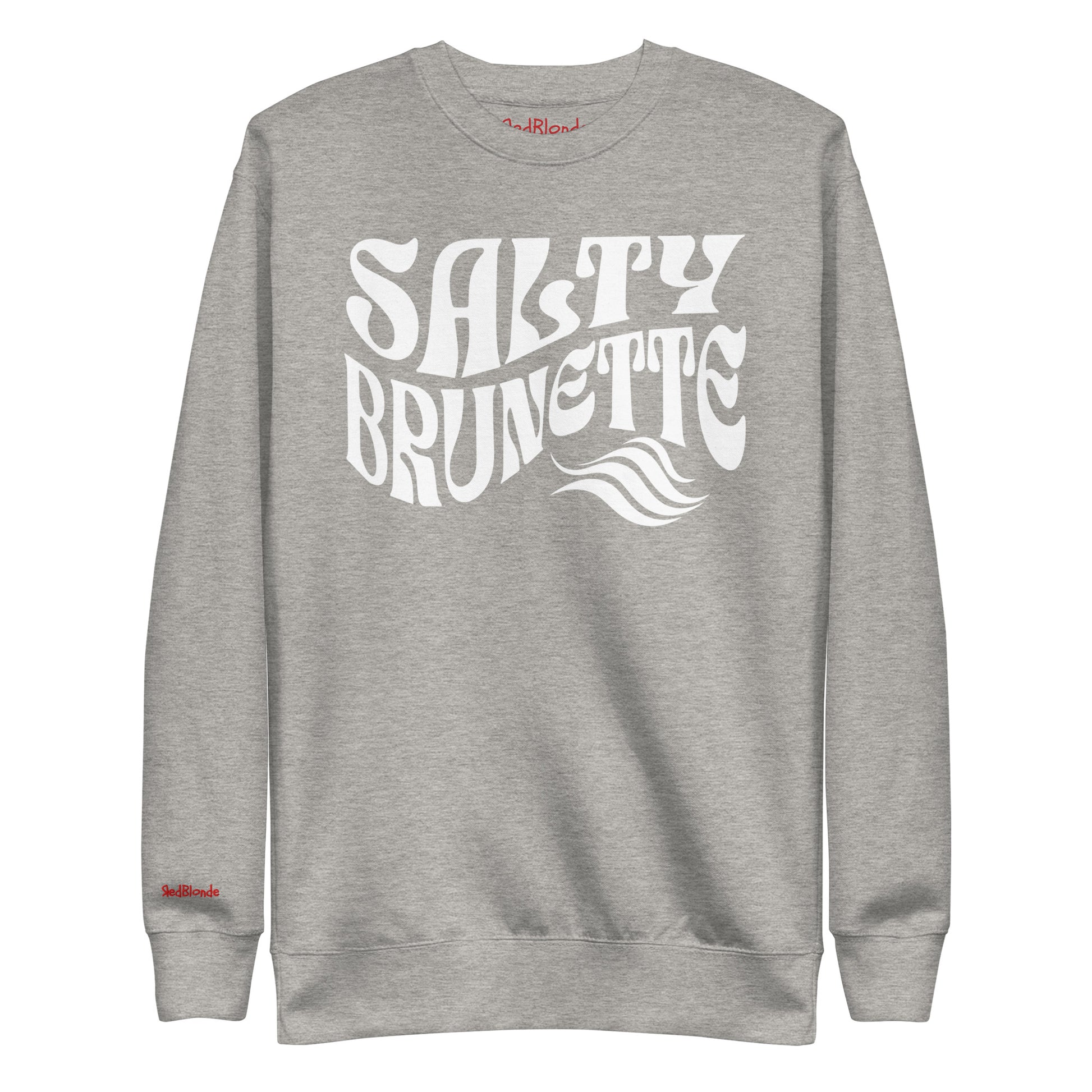 flatlay of Classic relaxed fit unisex sweatshirt in athletic light grey with 'Salty Brunette' play on words slogan in white retro 70s wavy text. Branded RedBlonde London in red on inside neck and right cuff