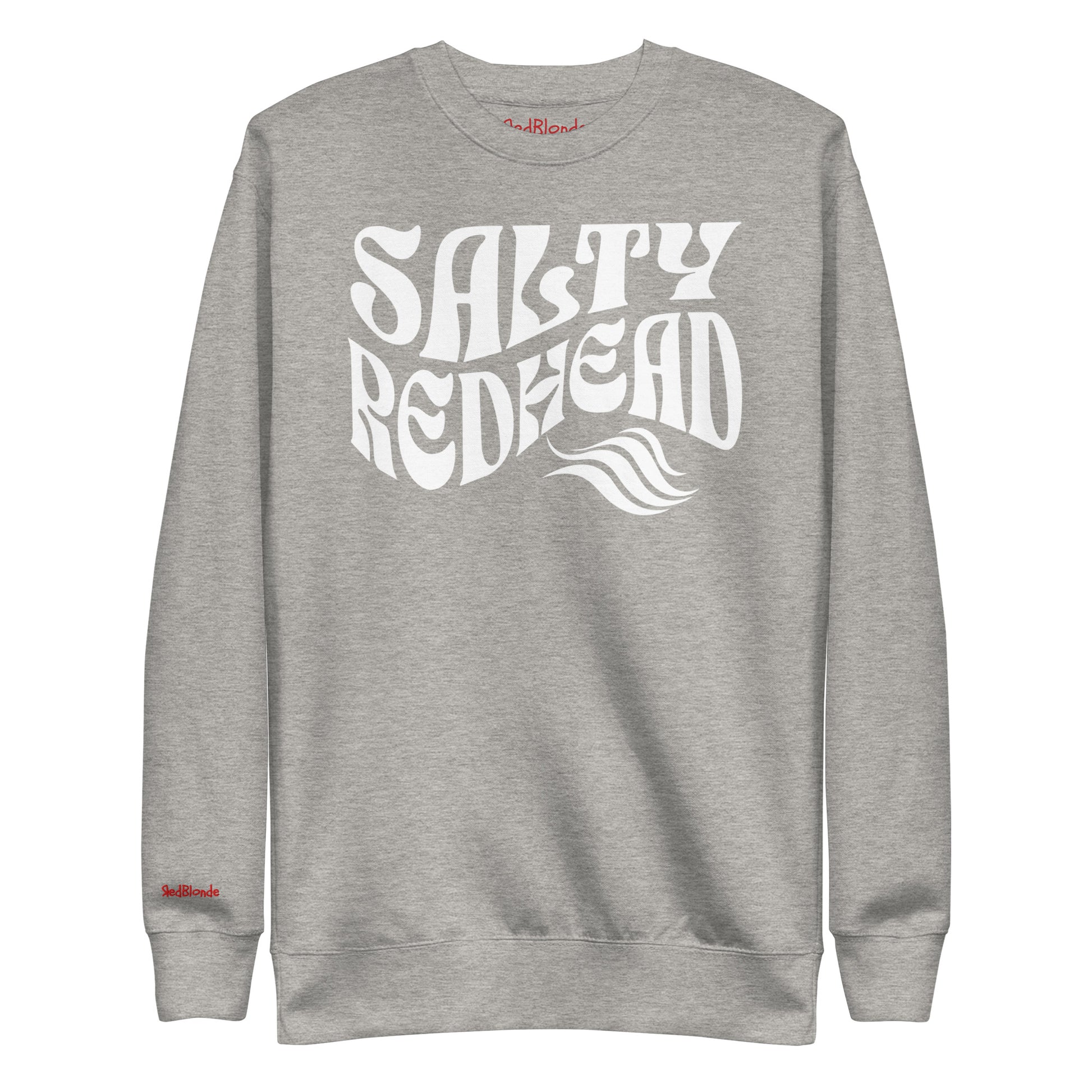 flatlay of Classic relaxed fit unisex sweatshirt in athletic light grey with 'Salty Redhead' play on words slogan in white retro wavy 70s text. Branded RedBlonde on inside neck and right cuff in red