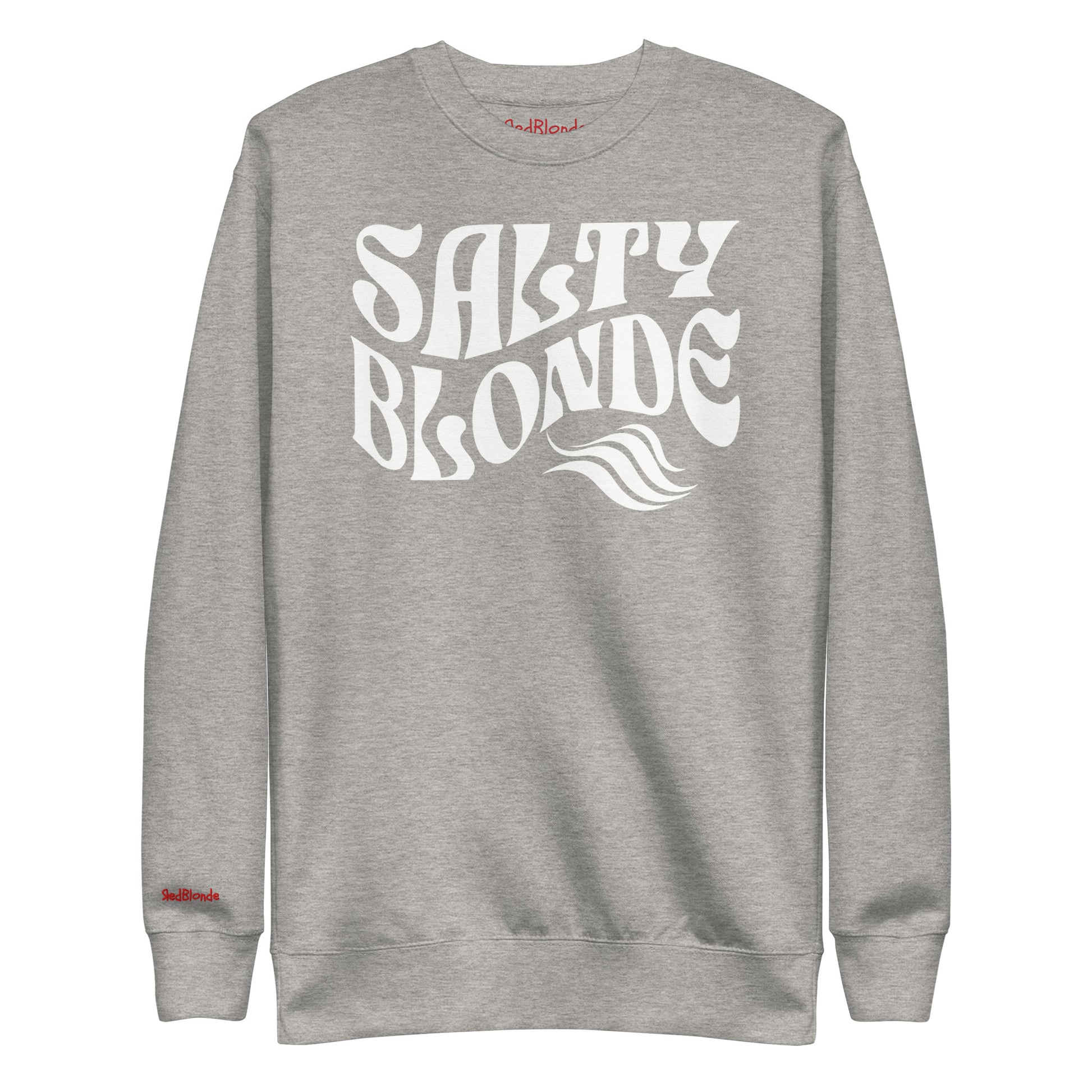 flatlay of Classic relaxed fit unisex sweatshirt in grey with 'Salty Blonde' play on words slogan in white retro 70s wavy text. Branded RedBlonde on inside neck and right cuff in red