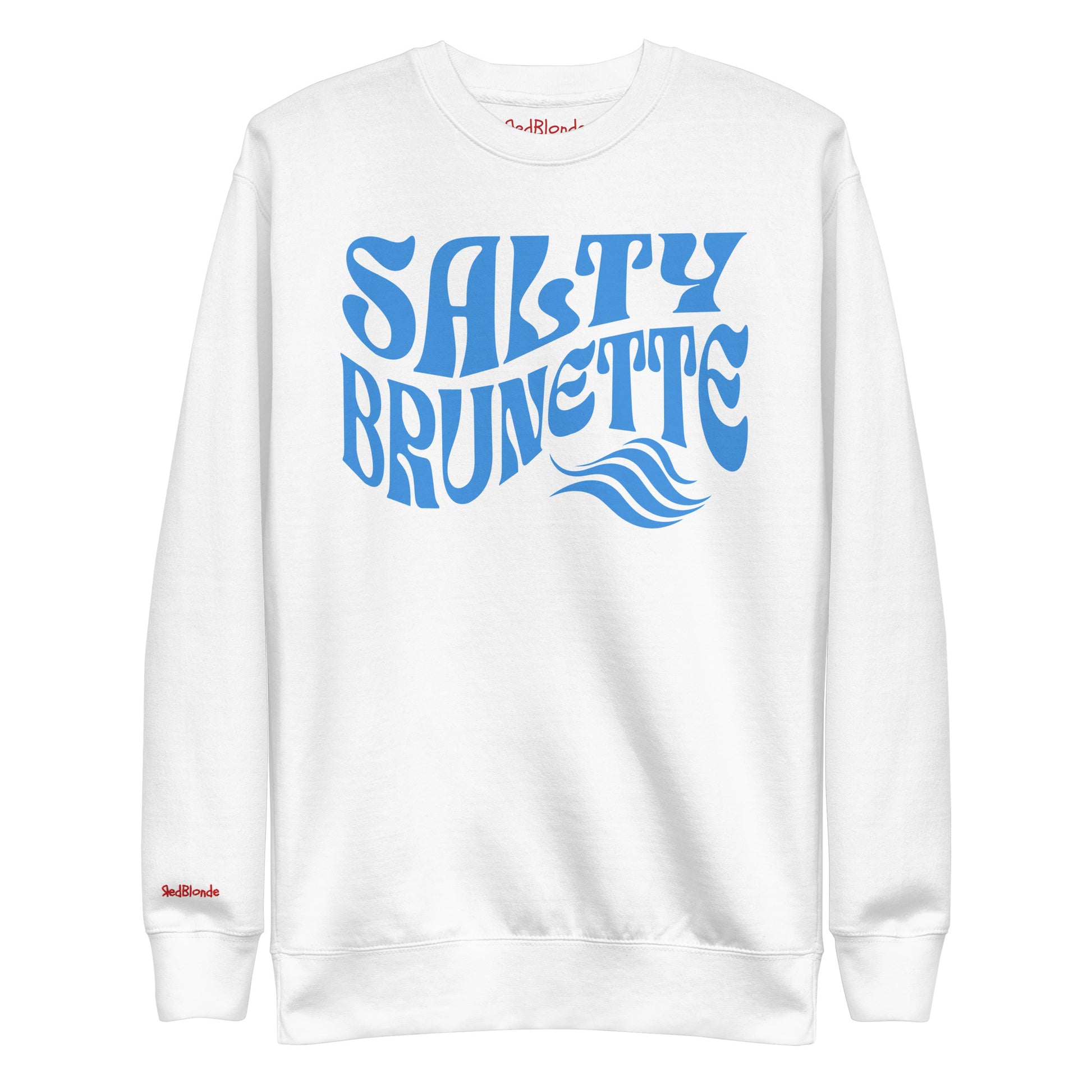 flatlay of Classic relaxed fit unisex sweatshirt in white with 'Salty Brunette' play on words slogan in blue retro 70s wavy text. Branded RedBlonde London in red on inside neck and right cuff