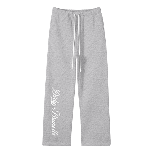 grey relaxed-fit straight joggers with white drawstrings and vintage-style “Dirty Brunette” milkstore script printed vertically down the leg — bold, effortless and unmistakably RedBlonde.