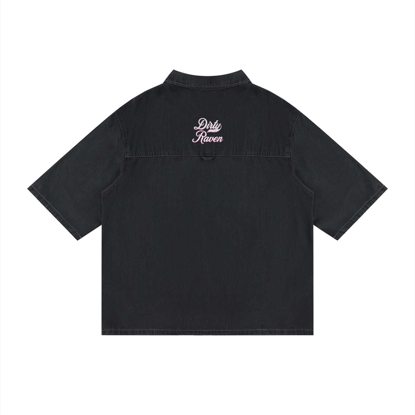 Back view of a black, short-sleeve button-up shirt with a subtle faded finish and a small raised “Dirty Raven” Milkstore script logo centered across the upper back.