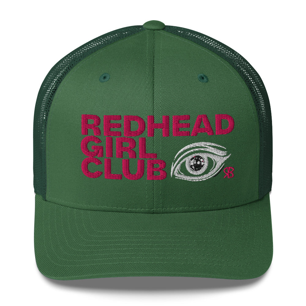 Green mesh trucker hat featuring bold red embroidered text “Redhead Girl Club” alongside a detailed embroidered eye graphic and a small red RB logo.