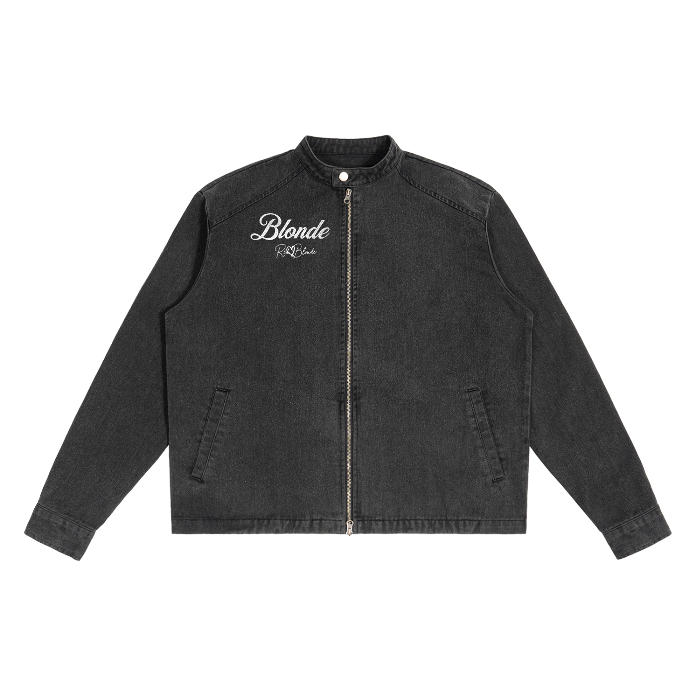 A washed-black denim jacket with a straight, boxy cut and a stand collar. The front features a full silver zip, two slanted pockets, and white embroidered text on the left chest that reads "Blonde" with the RedBlonde signature underneath. The jacket has long sleeves with button cuffs
