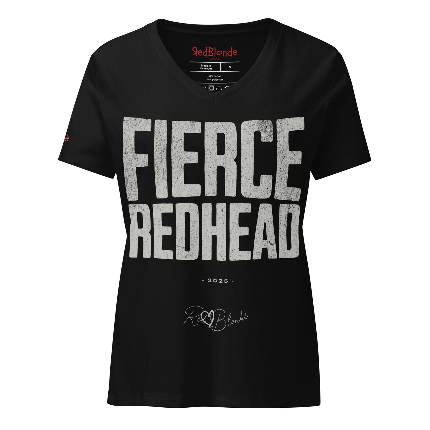 black women’s V-neck T-shirt featuring the bold black distressed text “FIERCE REDHEAD” in large North Road capital letters across the chest. Beneath the text, the year “2025” is printed in small type, with the “RedBlonde” brand signature logo below it. The inner collar shows the “RedBlonde” brand name in red along with sizing and care details, and “RedBlonde” is also printed in small red letters on the right sleeve.