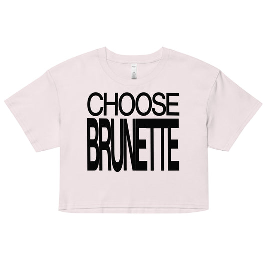 Flatlay of a orchid women's crop top  graphic t-shirt with “CHOOSE BRUNETTE” in black Helvetica Now font emblazoned on the front. 