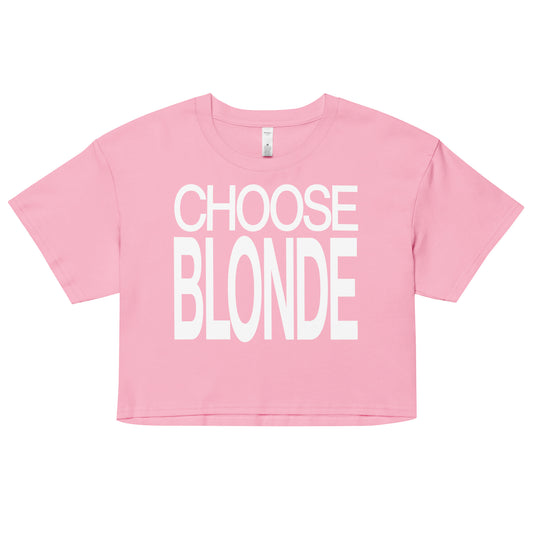 Flatlay of a pink women's crop top  graphic t-shirt with “Choose Blonde” in white Helvetica Now font emblazoned on the front. 