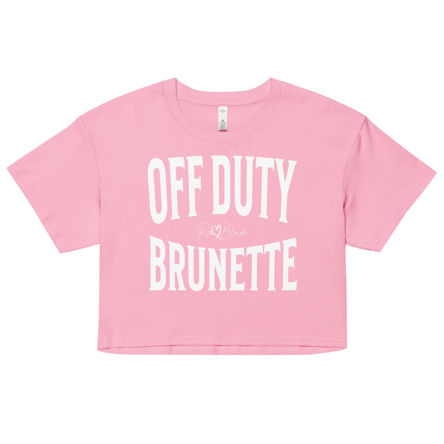 Flatlay of a pink women's crop top  graphic t-shirt with “OFF DUTY BRUNETTE” in white Helvetica Now font emblazoned on the front, signed off RedBlonde
