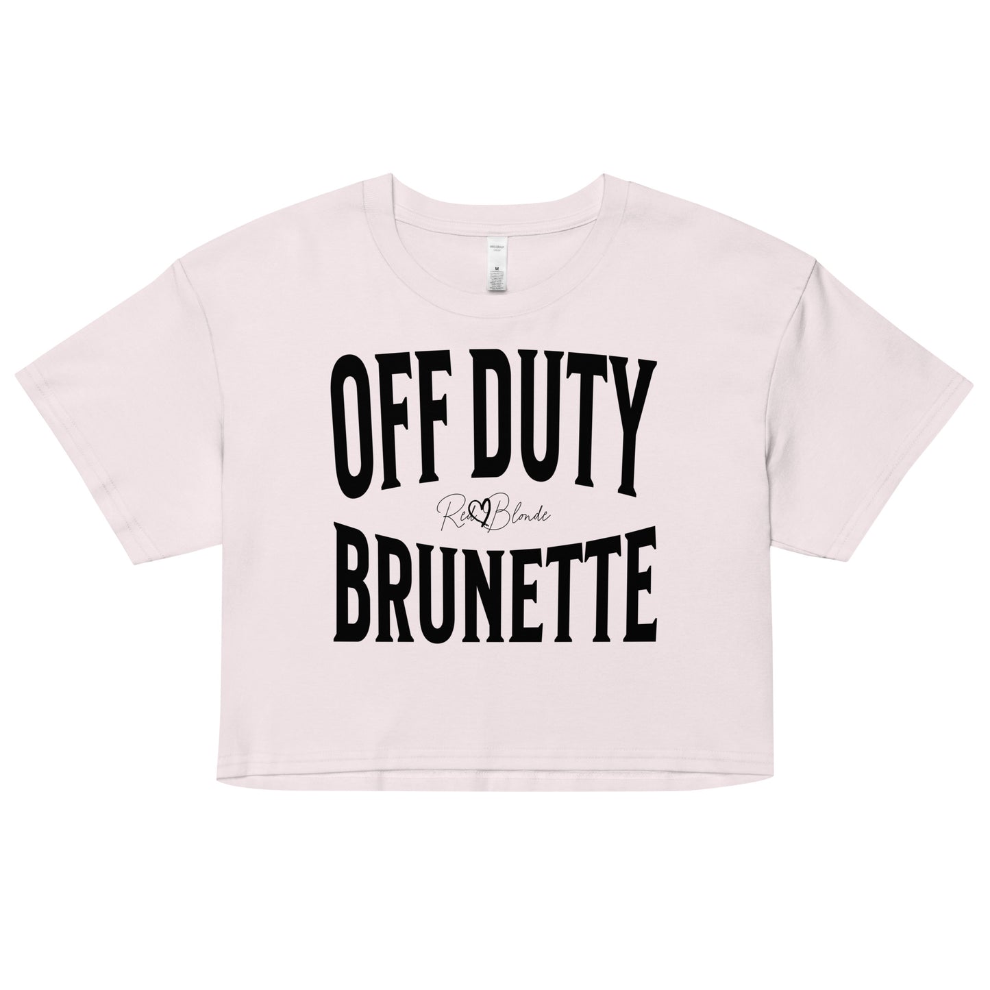 Flatlay of an orchid women's crop top  graphic t-shirt with “OFF DUTY BRUNETTE” in black Helvetica Now font emblazoned on the front, signed off RedBlonde