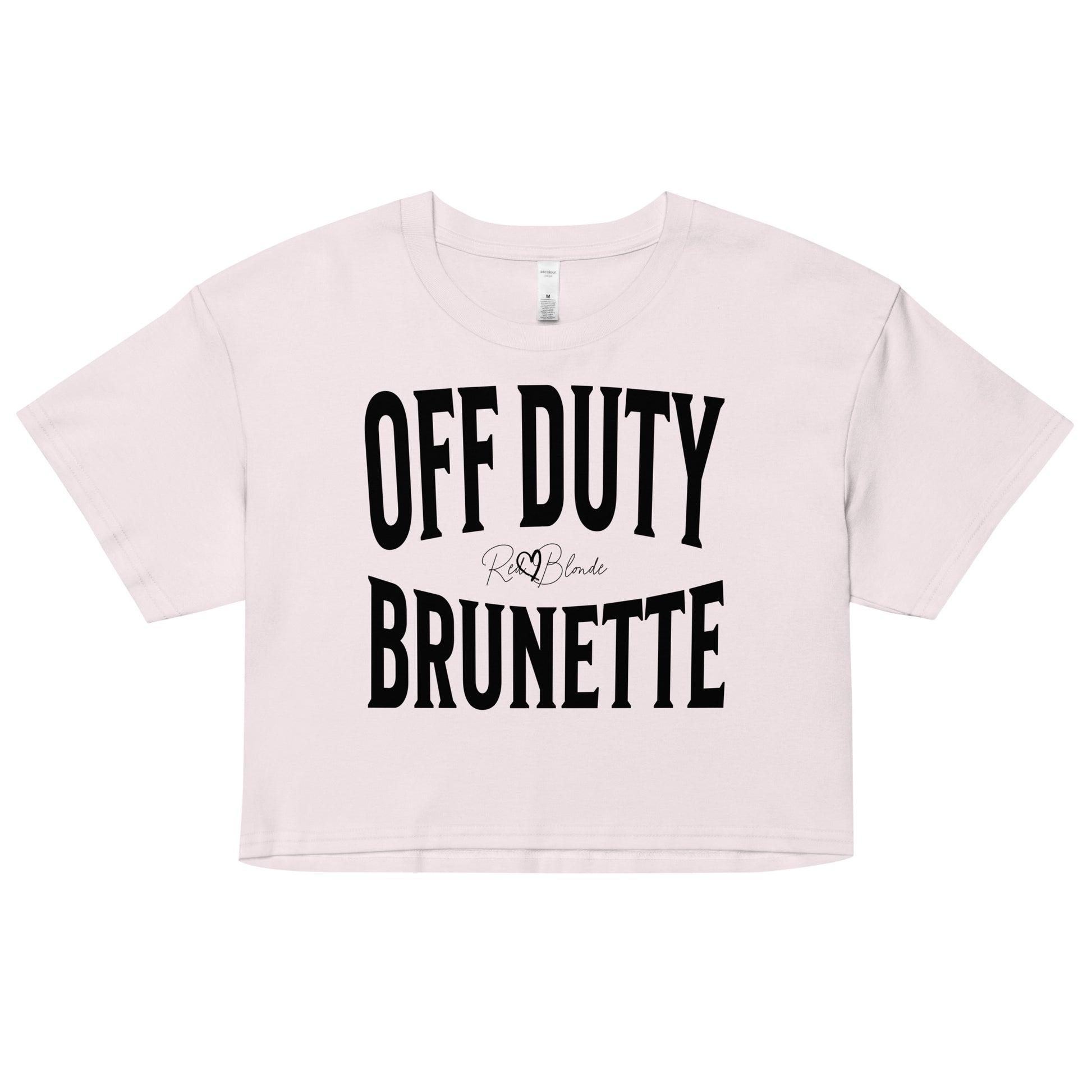 Flatlay of an orchid women's crop top  graphic t-shirt with “OFF DUTY BRUNETTE” in black Helvetica Now font emblazoned on the front, signed off RedBlonde