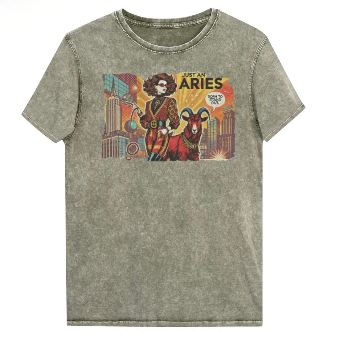 Flatlay of a unisex army green denim wash vintage t-shirt with a retro pop-art brunette Aries graphic featuring a Brunette woman, wearing a belted catsuit and high boots with one hand in her pocket, with a ram by her side and a city backdrop, captioned ‘Just an Aries, born to stand out'. Branded RedBlonde in red on inside neck and right sleeve