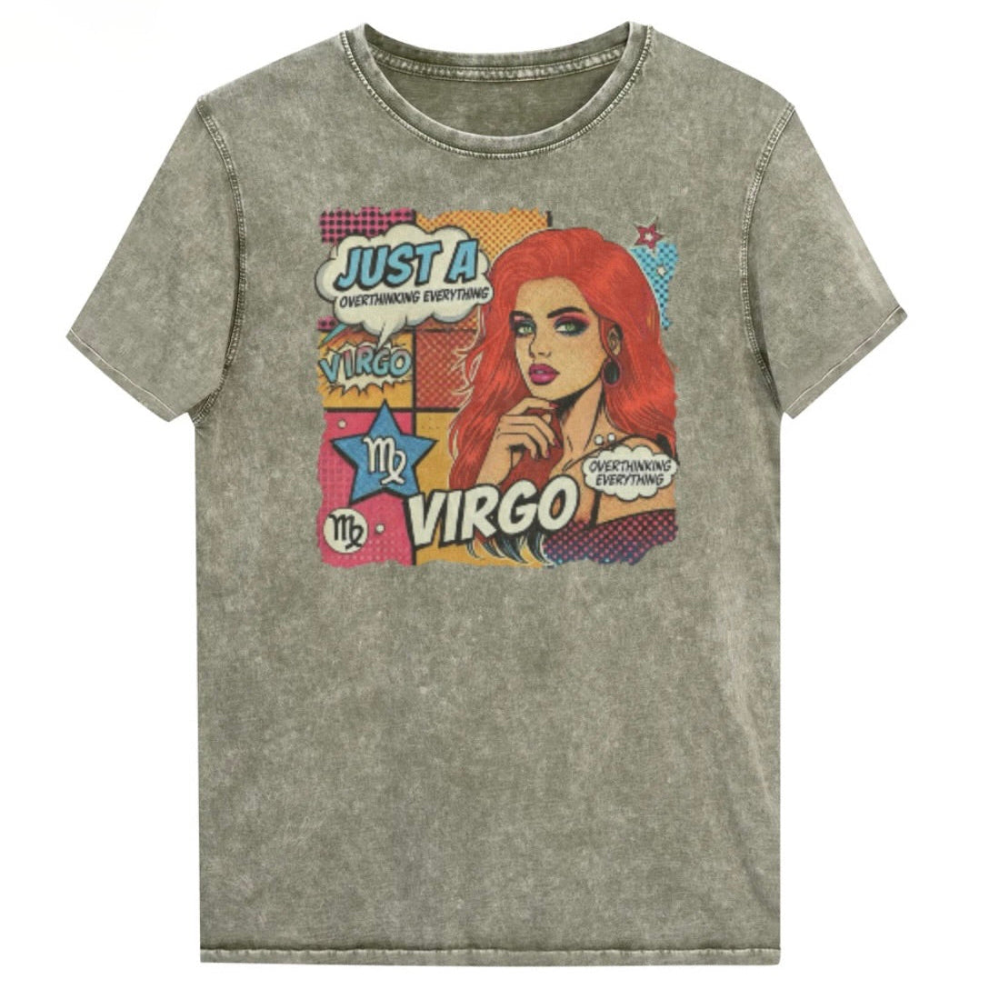 Flatlay of a unisex army green denim wash vintage t-shirt with a retro pop-art Virgo graphic featuring the head and shoulders of a redhead woman, wearing an off the shoulder top with her hand on her chin, the background is colourful chequered board with two bubble  captions ‘Just a Virgo, overthinking everything'. Branded RedBlonde in red on inside neck and right sleeve