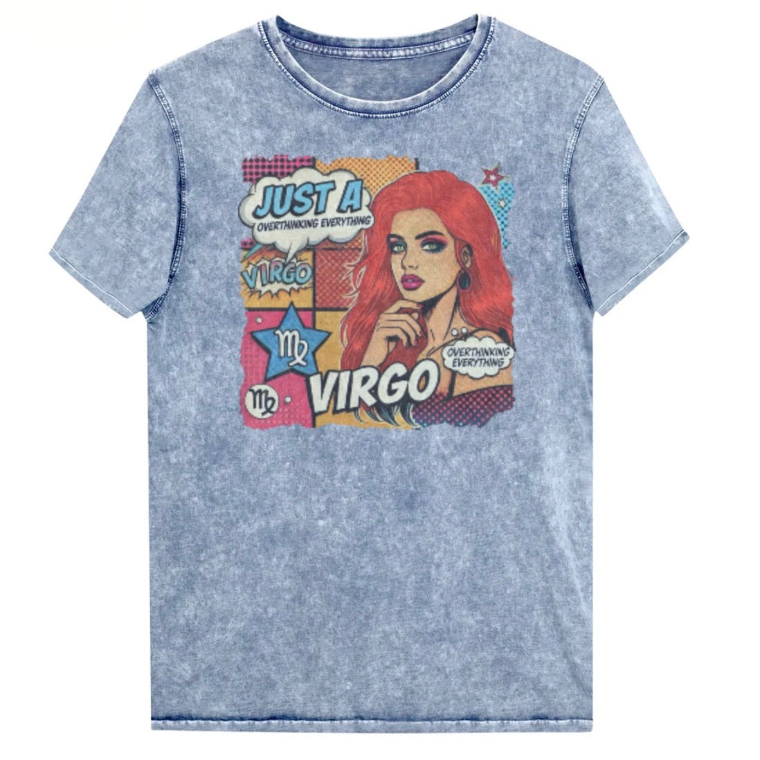 Flatlay of a unisex blue denim wash vintage t-shirt with a retro pop-art Virgo graphic featuring the head and shoulders of a redhead woman, wearing an off the shoulder top with her hand on her chin, the background is colourful chequered board with two bubble  captions ‘Just a Virgo, overthinking everything'. Branded RedBlonde in red on inside neck and right sleeve