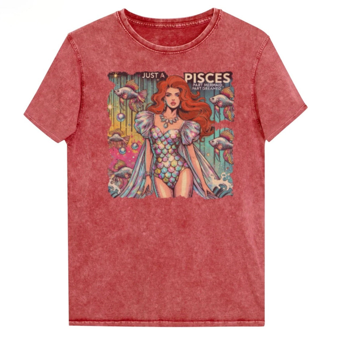 Flatlay of a unisex garnet red denim wash vintage t-shirt with a retro pop-art Pisces graphic featuring a redhead woman in a fish-scale dress, with fishes and bubbles backdrop, captioned ‘Just a Pisces, Part Mermaid, Part Dreamer'. Branded RedBlonde in red on inside neck and right shoulder